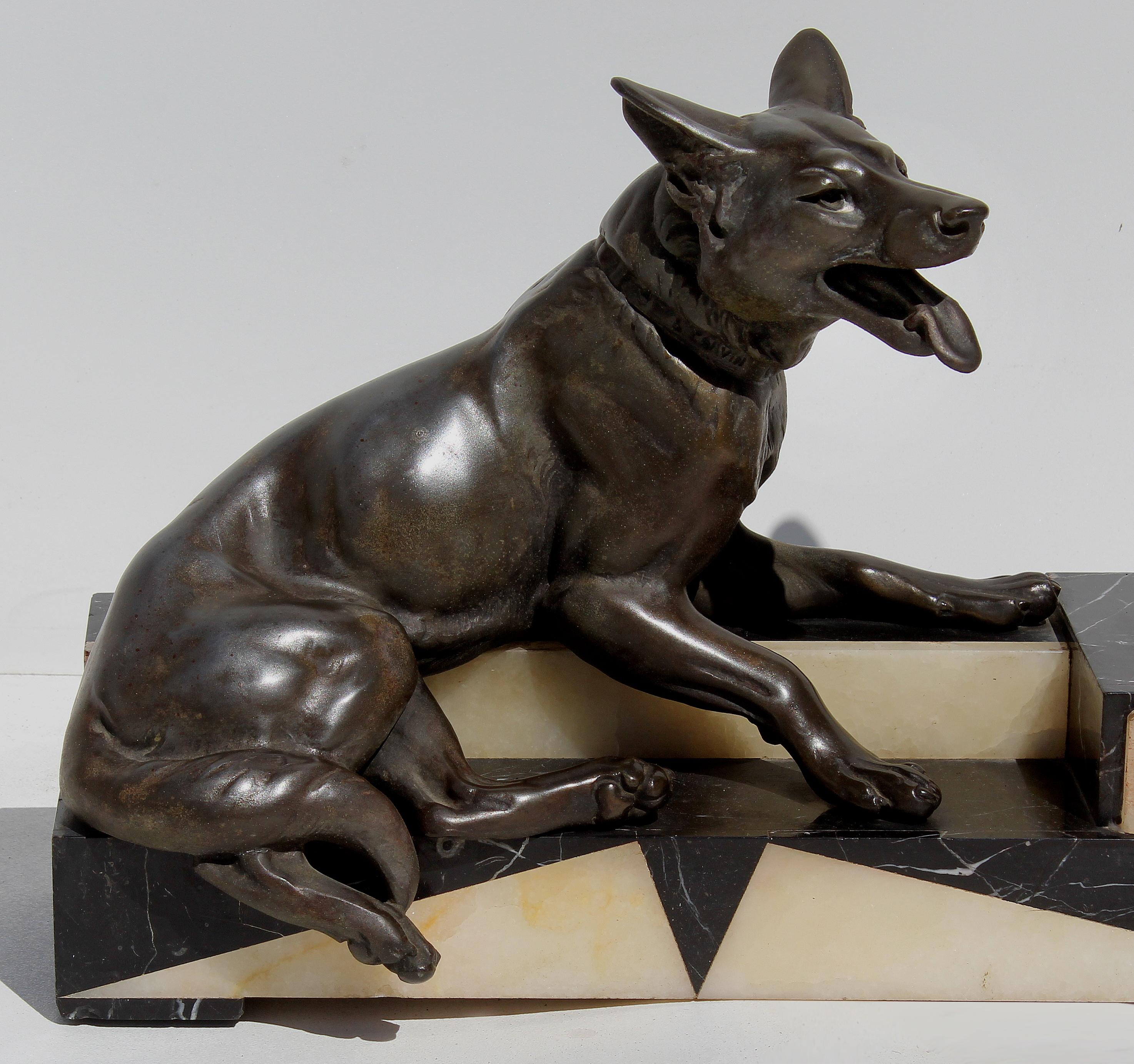 Louis-Albert Carvin Dog Animalier Art Deco Sculpture in Marble and Bronze 

Offered for sale is a large bronze sculpture of two German shepherds mounted on an Art Deco stylized marble base by Louis-Albert Carvin (French, 1875-1951). Engraved