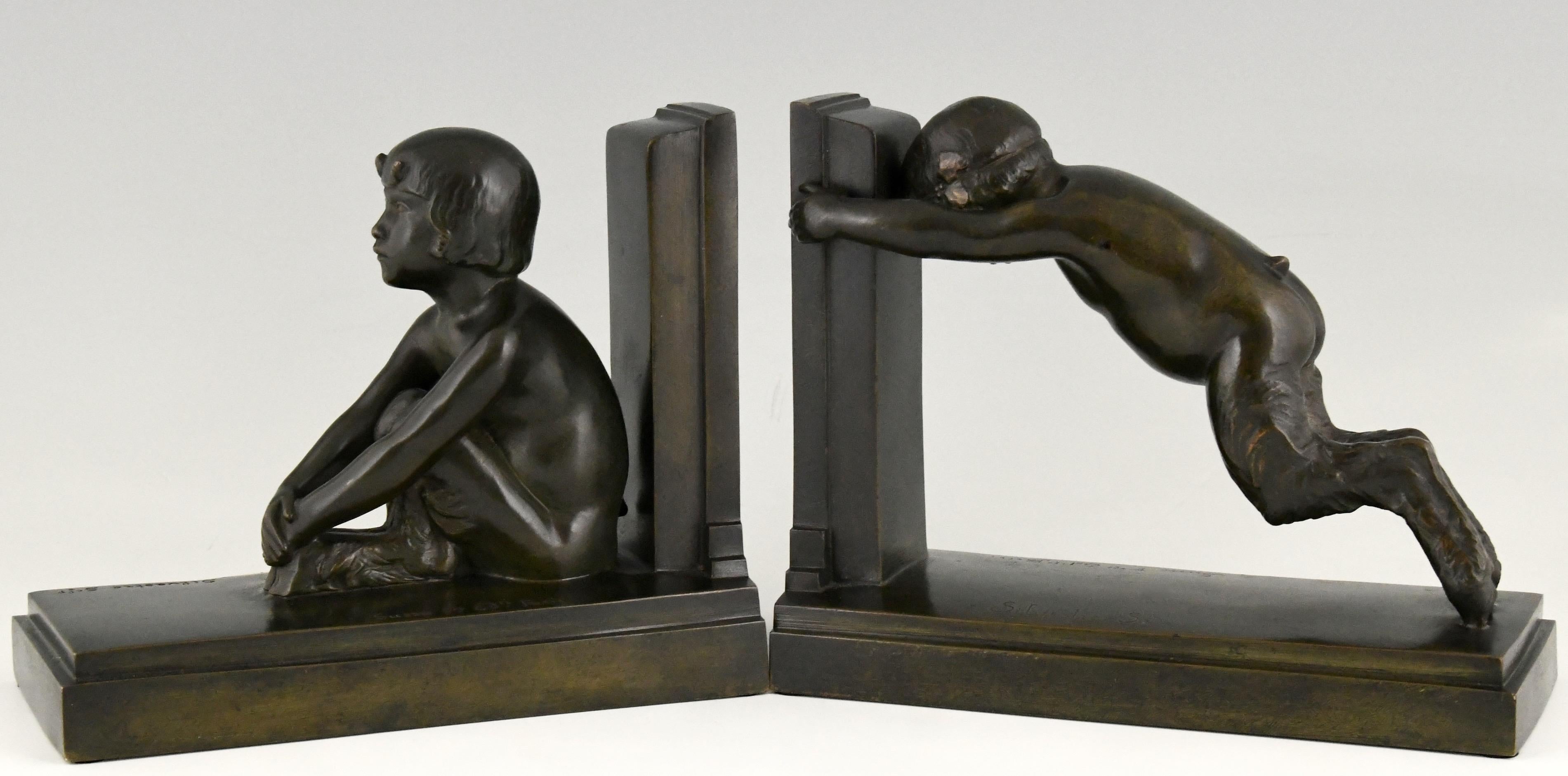 Tallest version of “Sit and push”, Art Deco bronze bookends boy and girl satyr. 
Signed by Paul Silvestre with Susse Freres founders' signature, France ca. 1920. Reduced version of the “Miroir d’eau” fountains in Paris and Lucerne.

The bookends