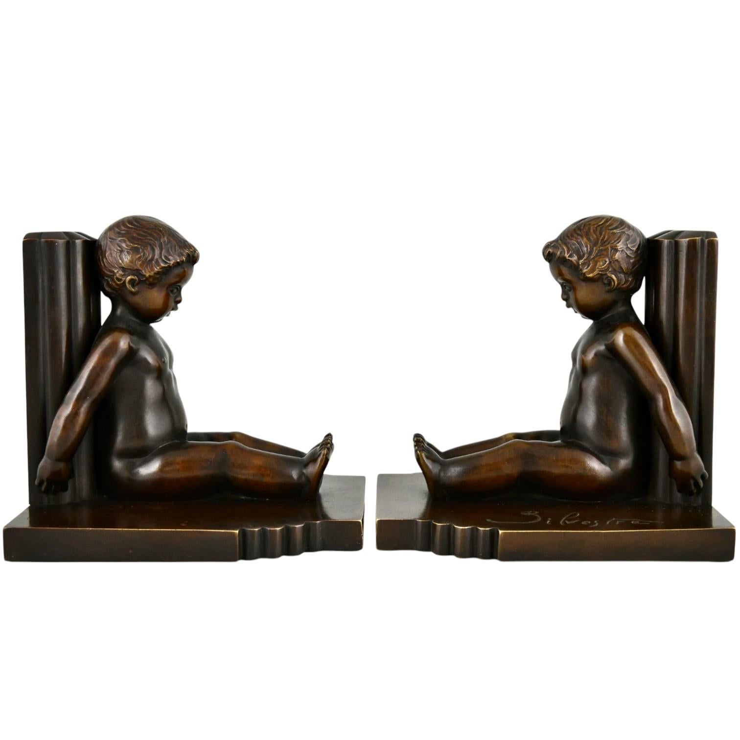 Patinato Reggilibri in bronzo Art Déco bambini Paul Silvestre e Susse Frères Francia 1920 in vendita