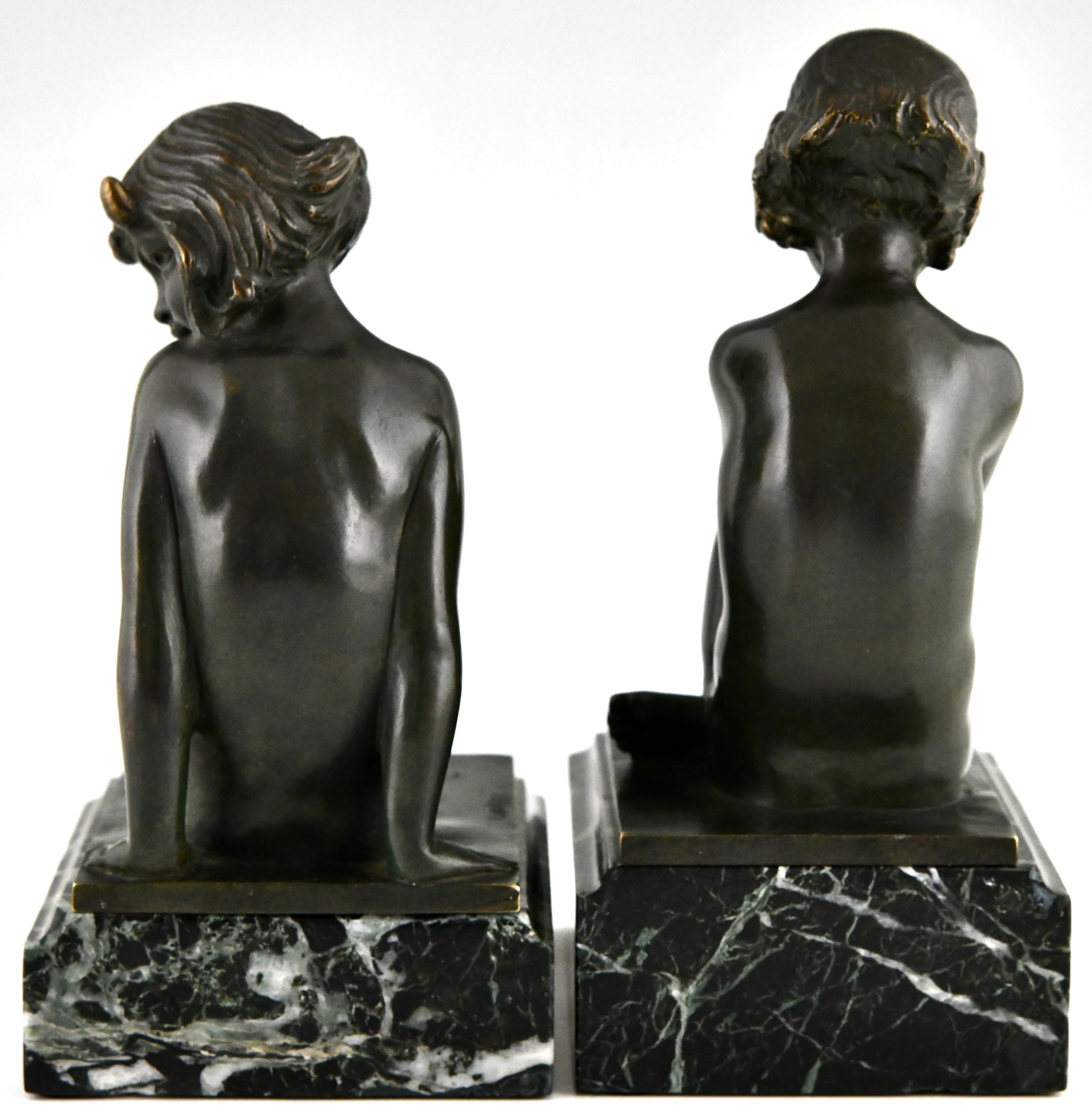 Patinated Art Deco bronze bookends faun and girl with grapes by Pierre Laurel, France 1925 For Sale