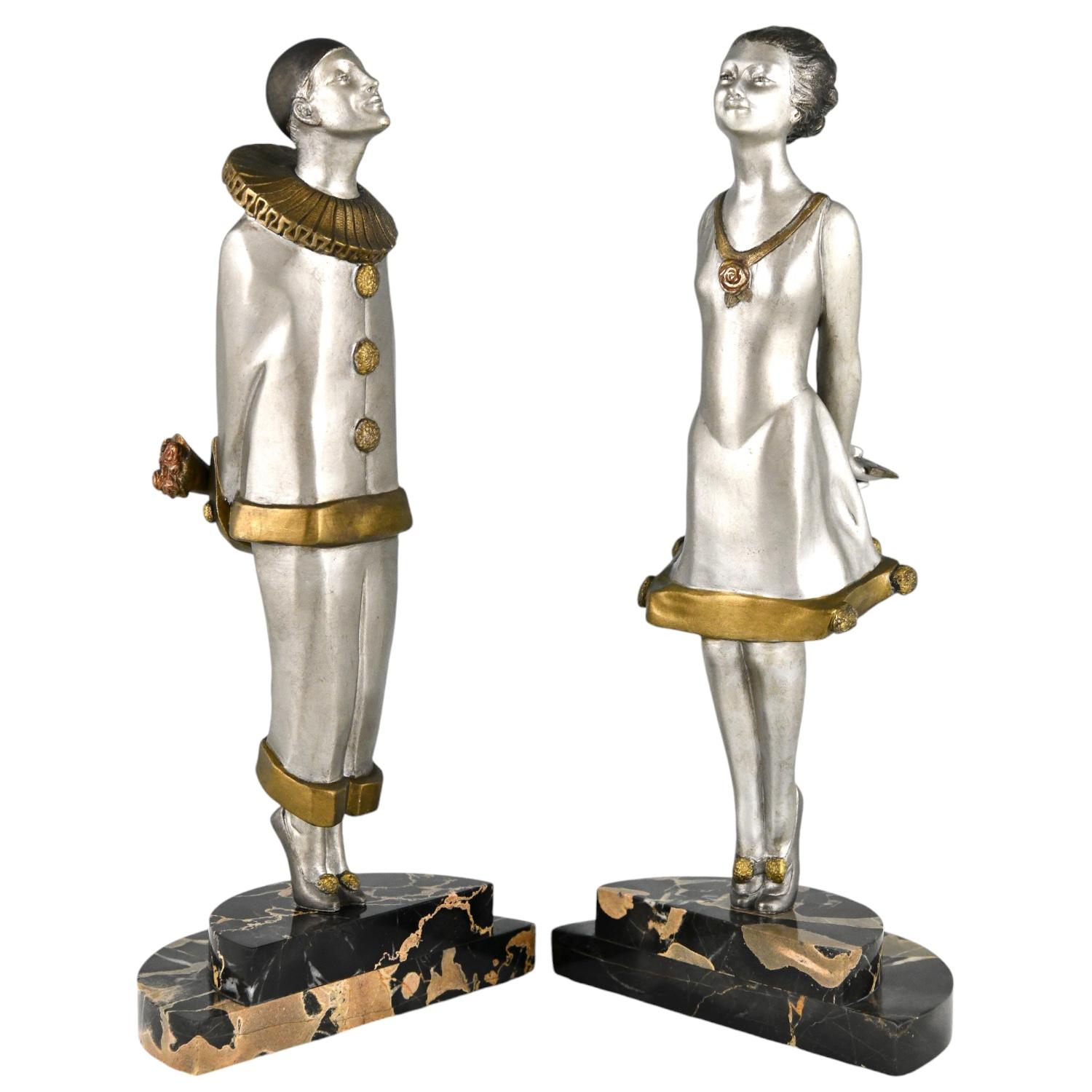 Art Deco bronze bookends pierrot and girl FLIRT by Marcel André Bouraine
Silvered and patinated bronze on a Portor marble base. 
France 1925.
These bookends are illustrated in
Art Deco and other figures, Brian Catley.
Information on the artist:
Art