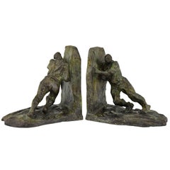 Serre-livres Art Déco en bronze Deux hommes qui poussent Victor Demanet 1925 France