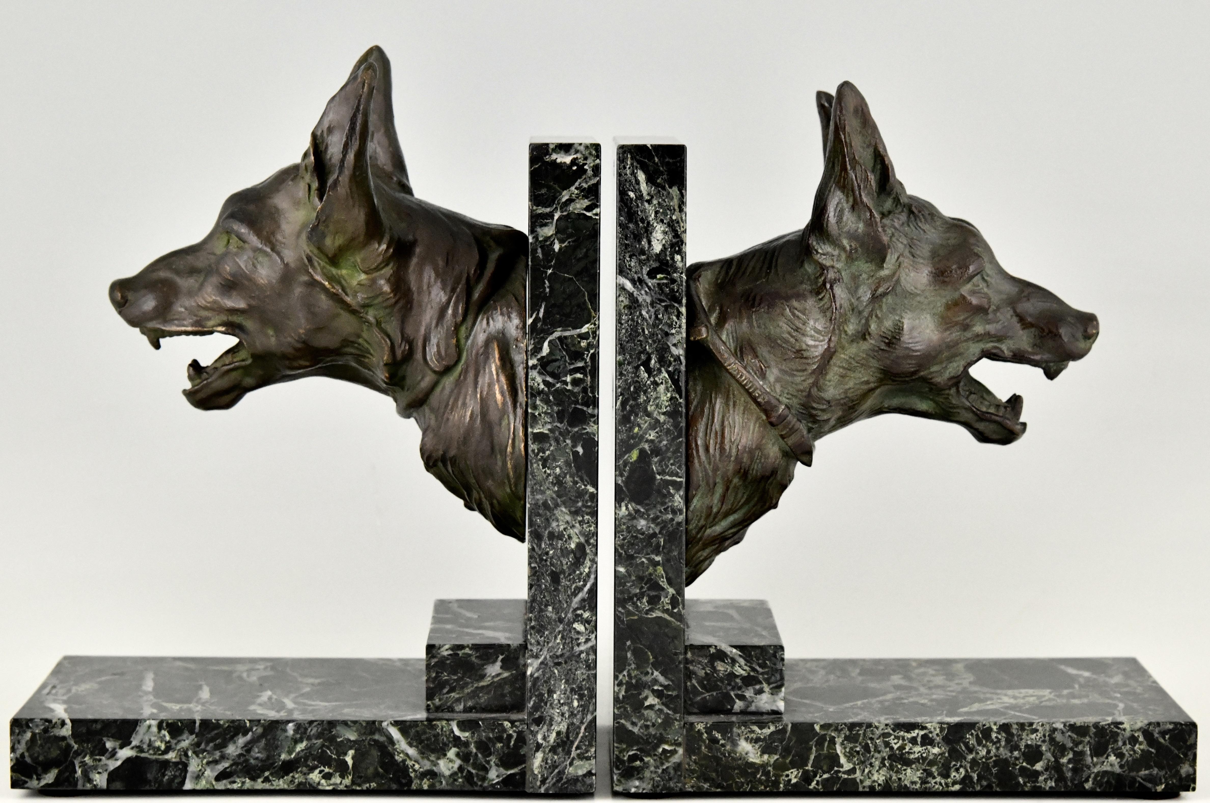 Art Deco bronze bookends with shepherd dogs by R. Varnier. France ca. 1925. 
Patinated bronze on marble bases.