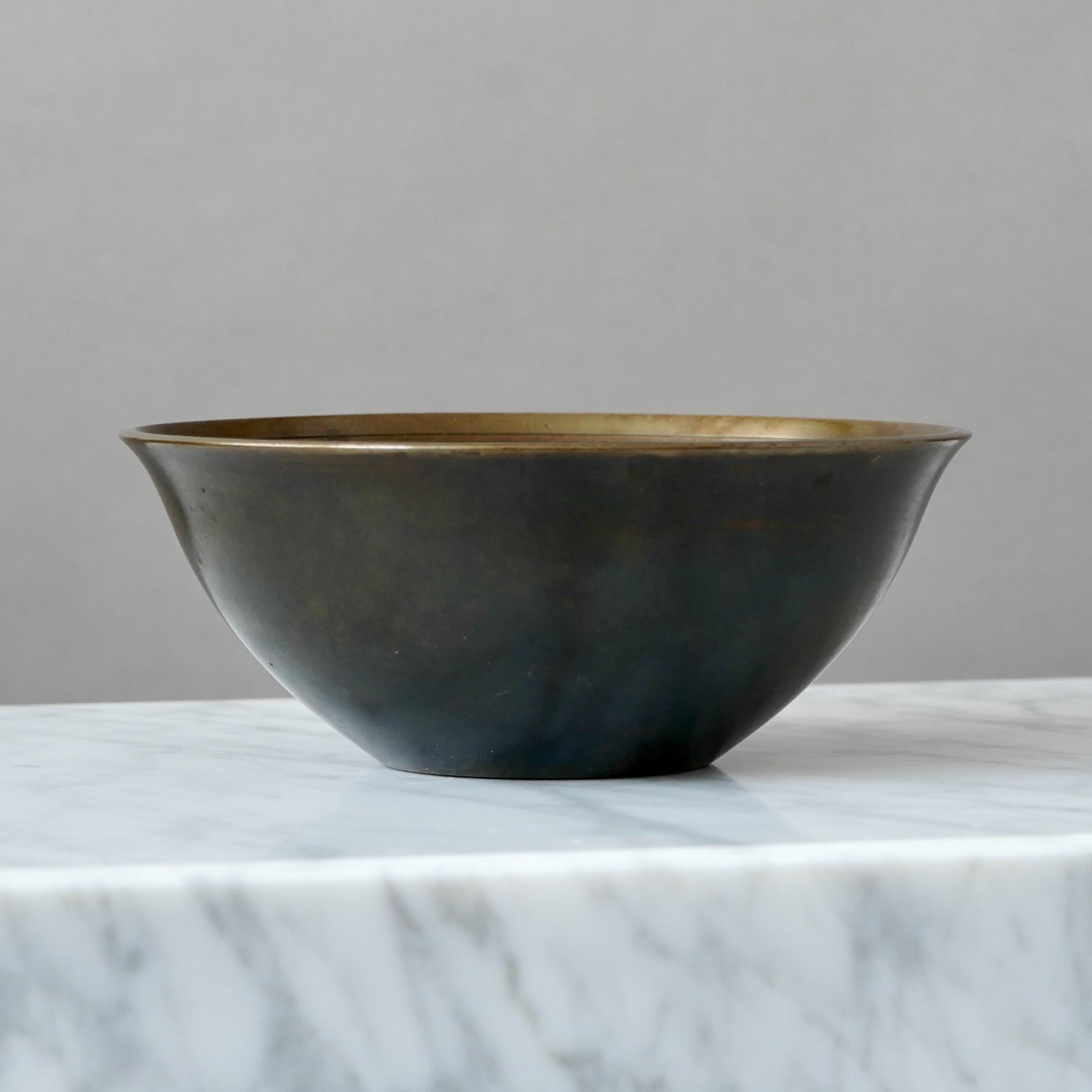 A beautiful art deco bronze bowl designed by Just Andersen in 1920s and produced by his own company in Denmark.

Good condition, some light scratches and wear to the patination.
Stamped 'DENMARK', model number and makers mark.

Just Andersen