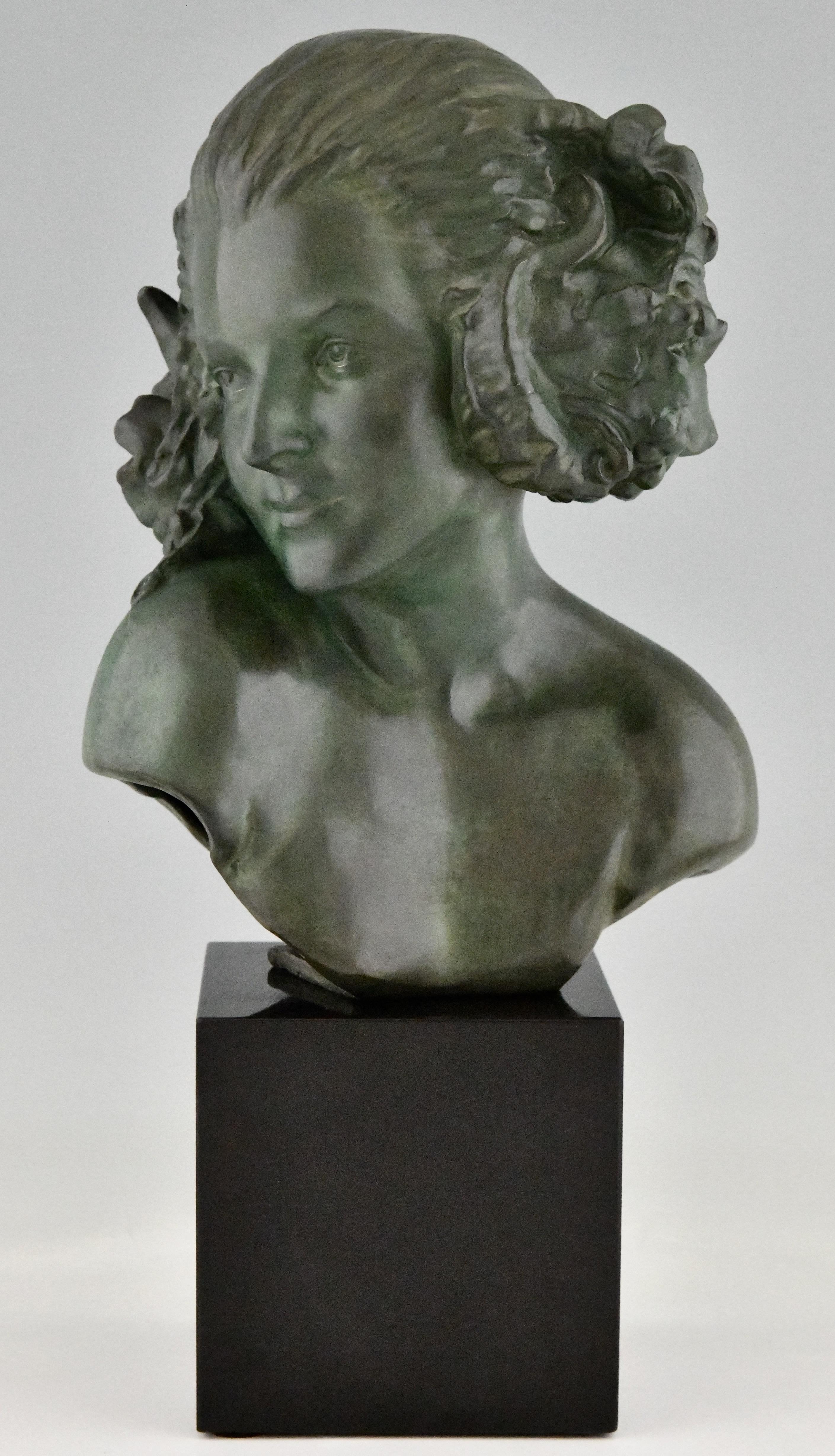 Art Deco bronze bust of a female satyr by Maxime Real del Sarte. Bronze with dark lovely green patina on a Belgian Black marble base, France 1921.

This sculpture has been rewarded Grand Prix National des beaux Arts in 1921 
Literature:
Bronzes,