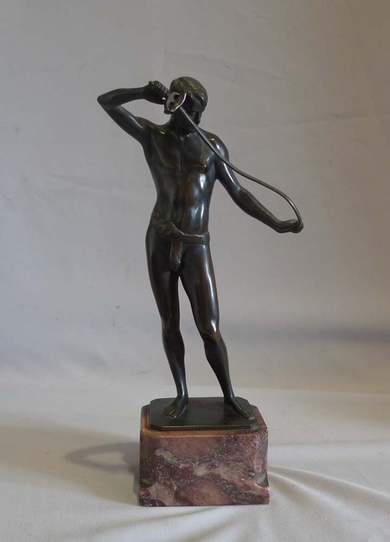 Fine early 20th century Art deco period bronze of a fencer holding and bending his rapier. The well modelled figure is naked except for a loincloth and he is seen looking down and flexing the blade of his rapier. Ludwig Eisenberger was a German