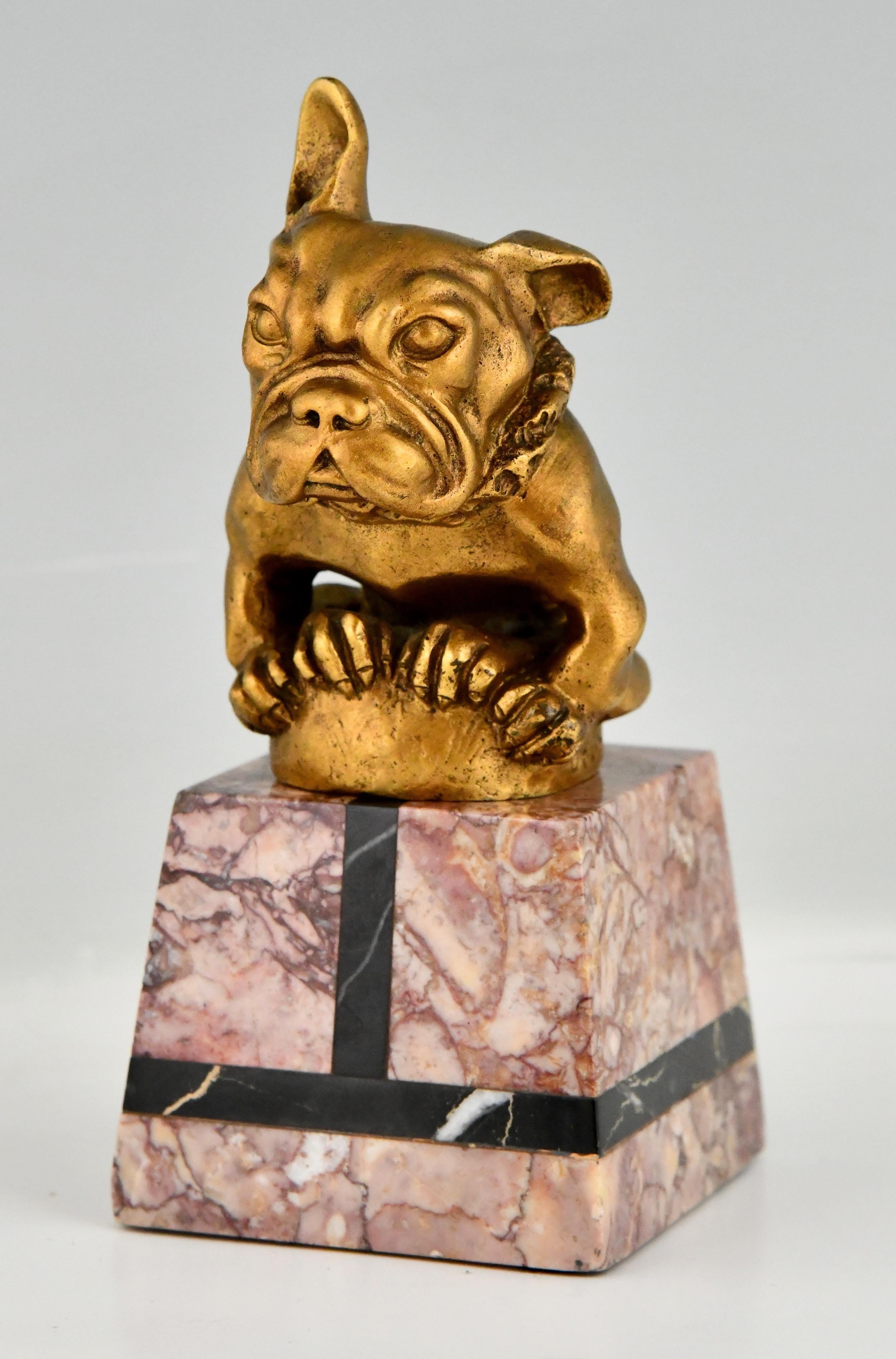 Art Deco bronze car mascot French bulldog signed by Gaston H. Bourcart.
The hood ornament is in gilt bronze and stands on a marble base. 
France 1925.
This mascot is illustrated plate nr. 329 
Mascottes passion, Michel Legrand, Antic show