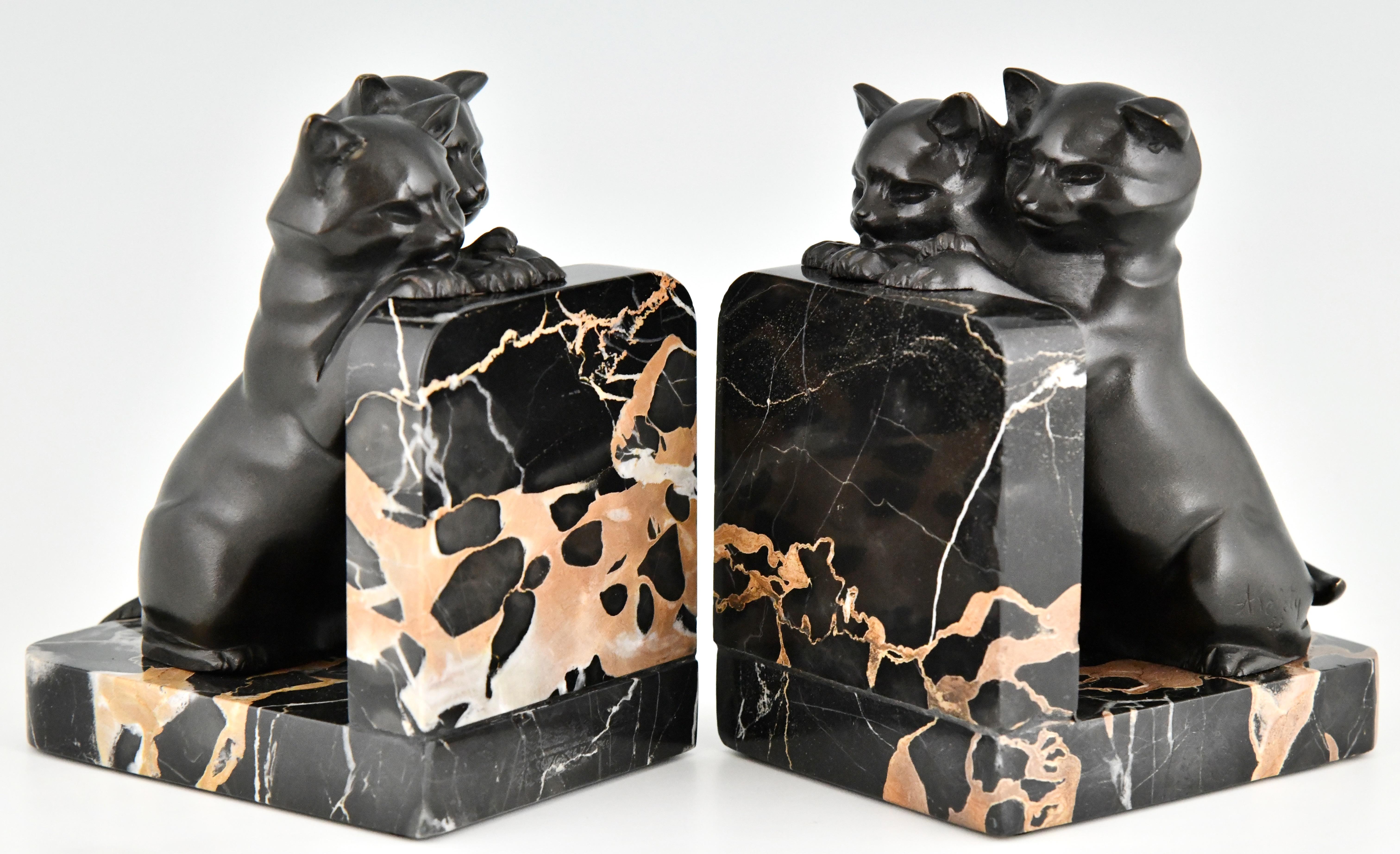 Art Deco bronze cat bookends by Alexandre Kelety.
Bronze with black patina. Portor marble bases.
France 1930.
Signed A. Kelety with stamped number. 
Literature:
Art Deco sculpture by Victor Arwas, Academy.
Art Deco and other figures by Brian Catley,