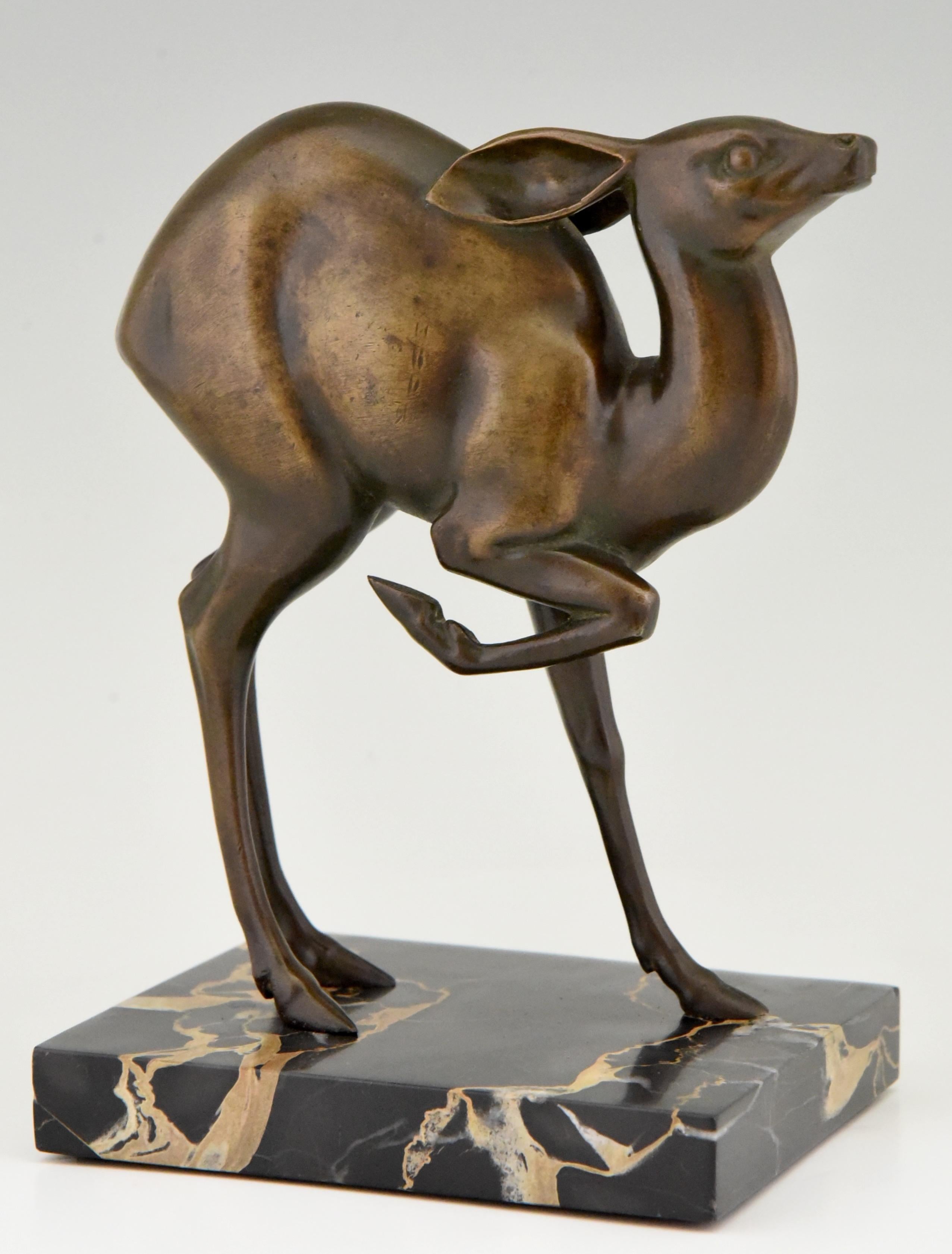 Art Deco bronze sculpture of a deer by the French artist Rischmann.
The sculpture has a beautiful patina and stands on a Portor marble plinth,
circa 1925.  

This bronze is illustrated in? “Art Deco sculpture and metalware” by ?Alfred W. Edward.