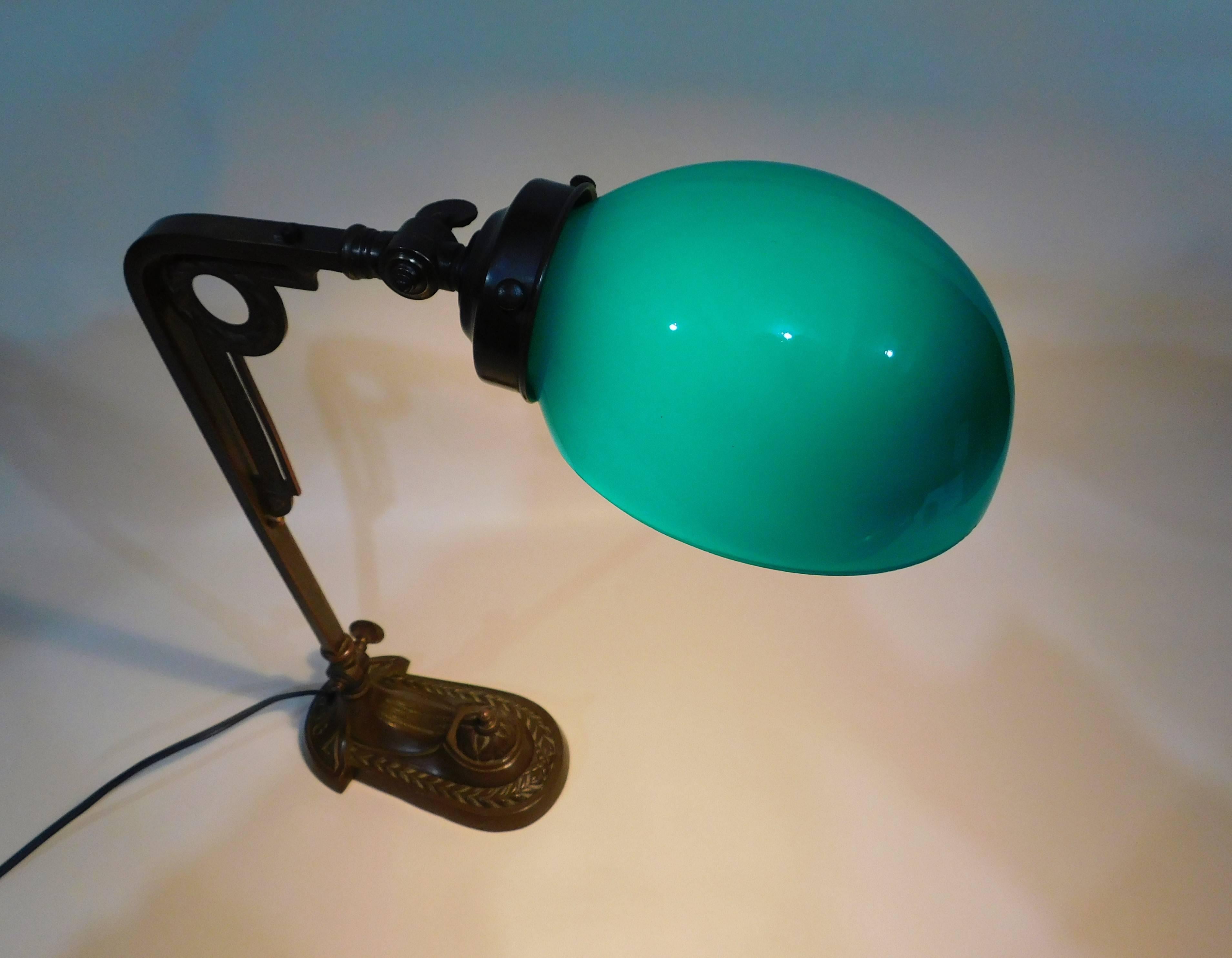 Art Deco bronze table desk lamp with original green glass shade, in excellent condition.