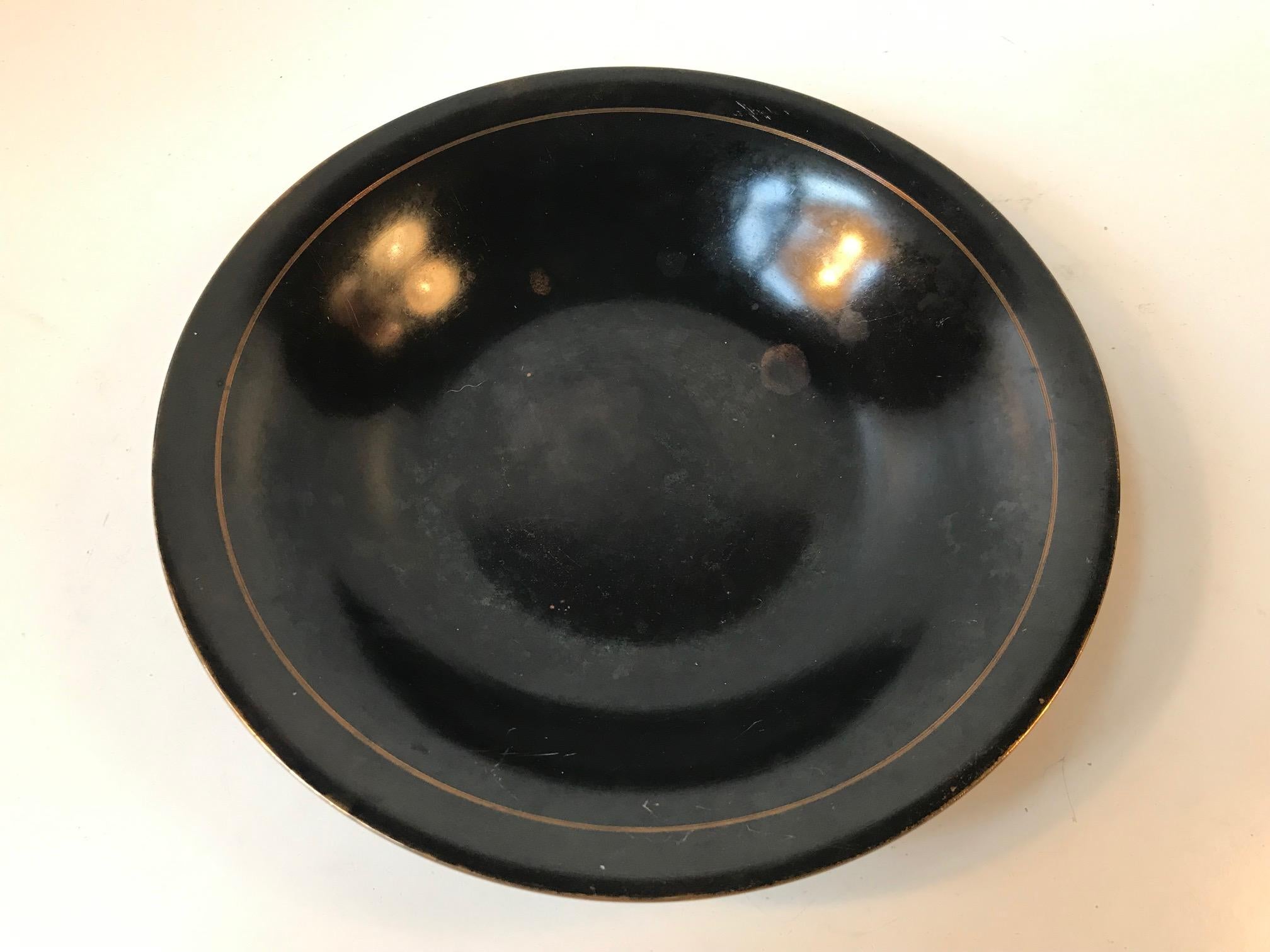 Patinated bronze bowl manufactured and designed by Frederiksberg Bronce in Denmark during the 1930s. The maker's mark and design number can be found on the bottom of the piece.