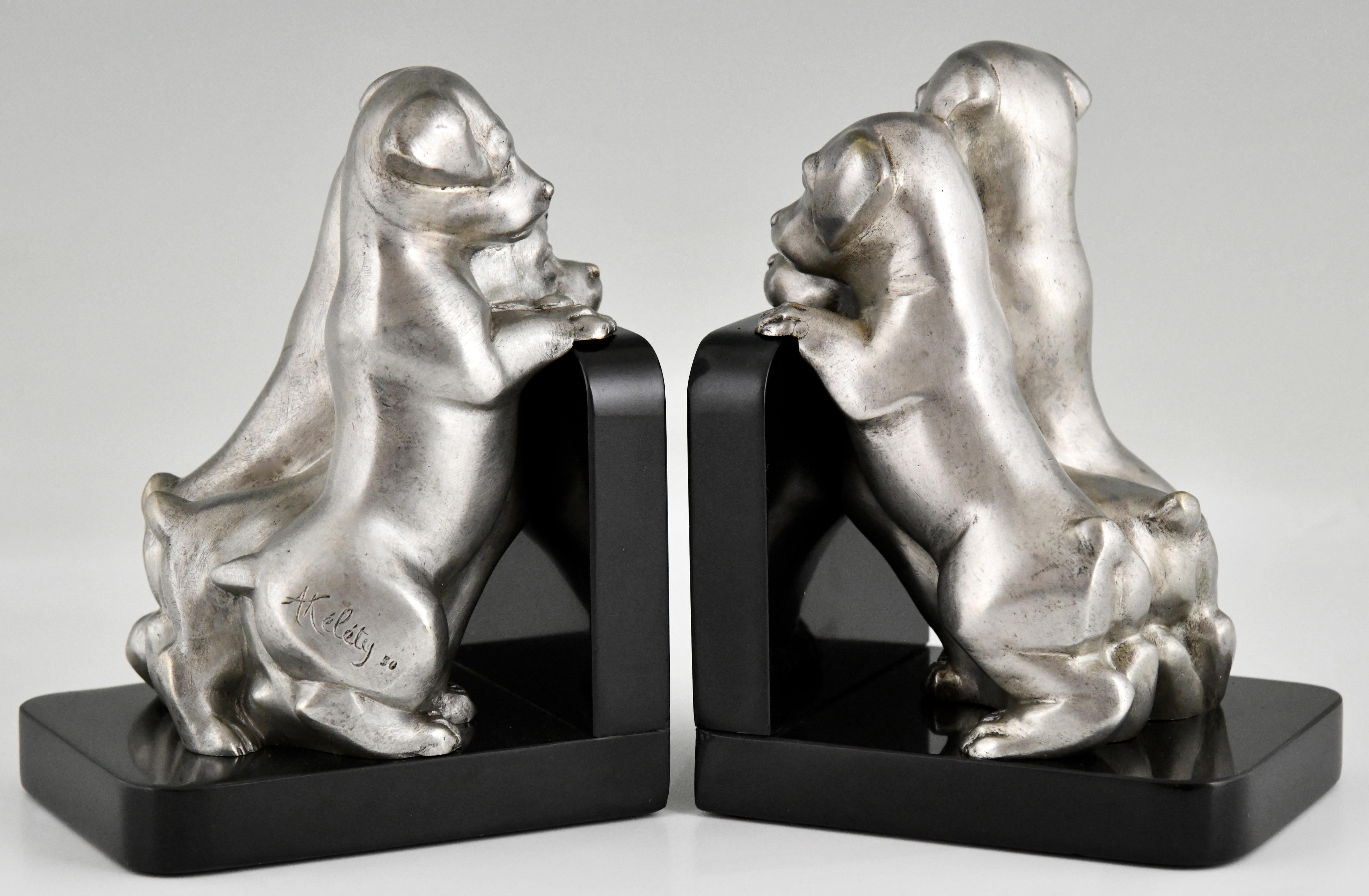 Art Deco bronze dog bookends by Alexandre Kelety
Bronze with silver patina. Belgian Black marble bases
France 1930. 
Signed A. Kelety with stamped number. 
Information on the artist:
Art Deco sculpture by Victor Arwas, Academy. 
Art Deco and