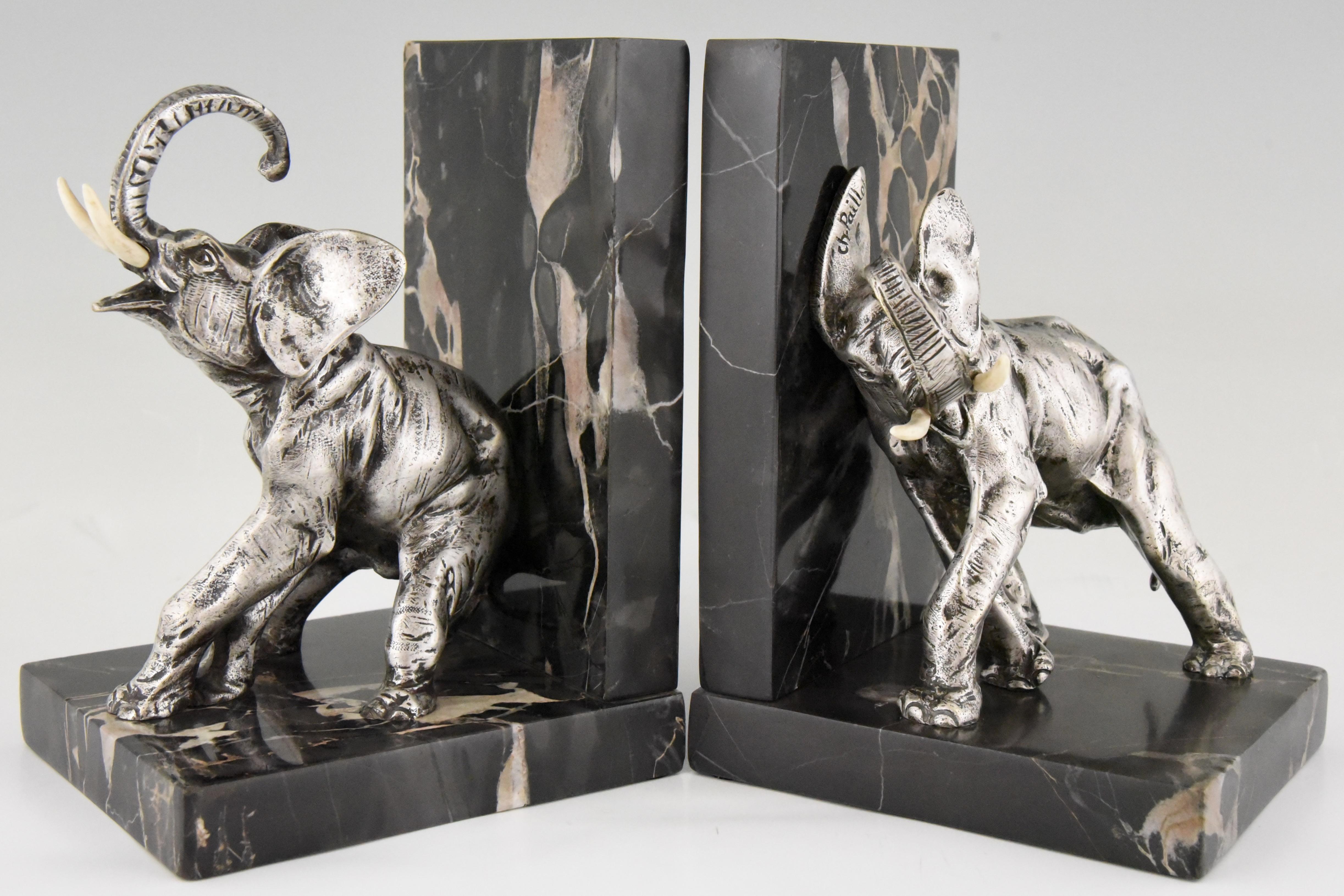 Art Deco bronze elephant bookends with silver patina on portor marble base.
Signed by Charles Paillet who lived in France, 1871-1937.
Literature:
“Animals in bronze” by Christopher Payne. ?Antique collectors club. ?“Les bronzes de XIXe siècle” by