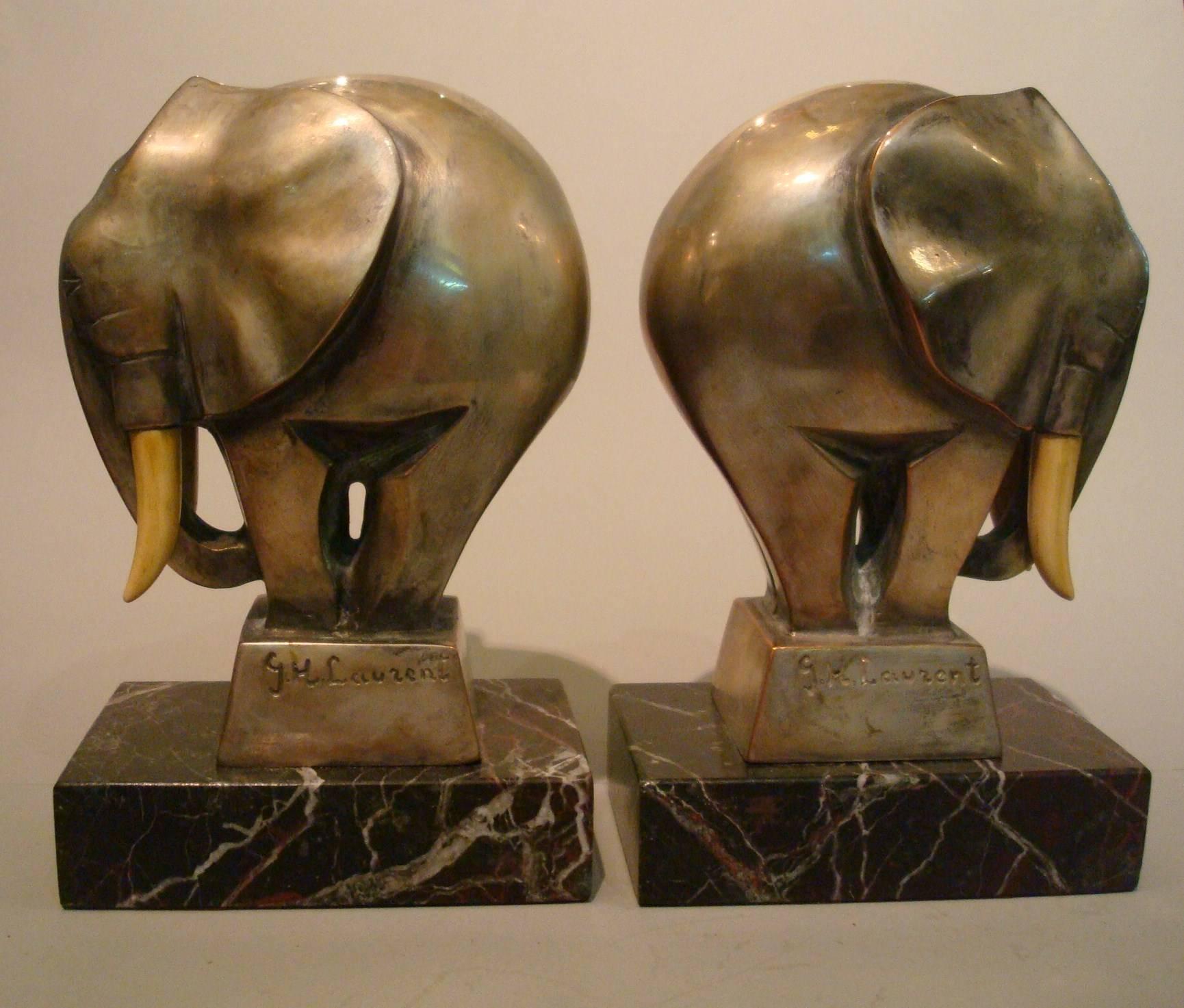 Fantastic Art Deco silvered bronze elephant bookends signed G. H. Laurent, France, 1920s. Perfect desk piece. Nice and heavy bronze bookends mounted over marble bases. Nice animal Sculpture. Age wear on the plating.