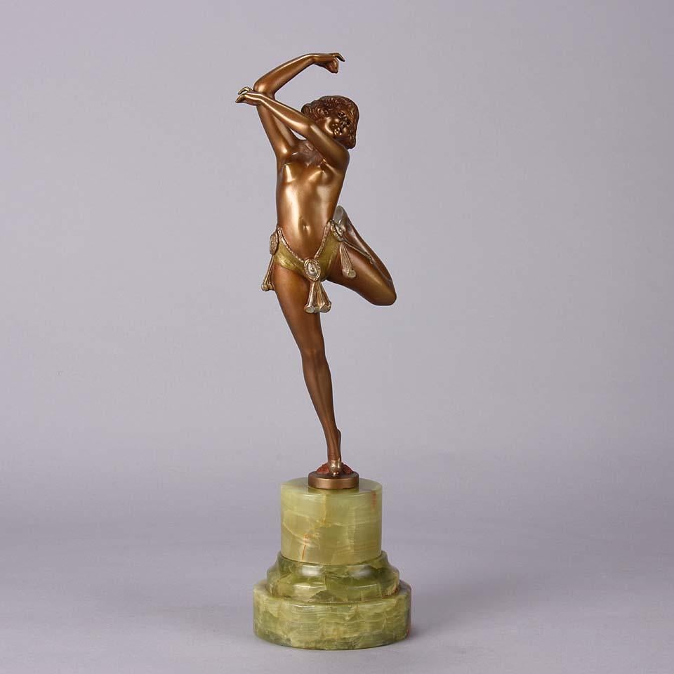 A fabulous Art Deco cold painted bronze figure of an erotic beauty in an energetic pose, exhibiting excellent color and very fine hand finished detail, raised on an onyx base and signed Zach

Bruno Zach (German, 1891-1935), Bruno Zach was a