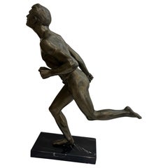 Art Deco bronze figure of a man wearing a loin cloth running