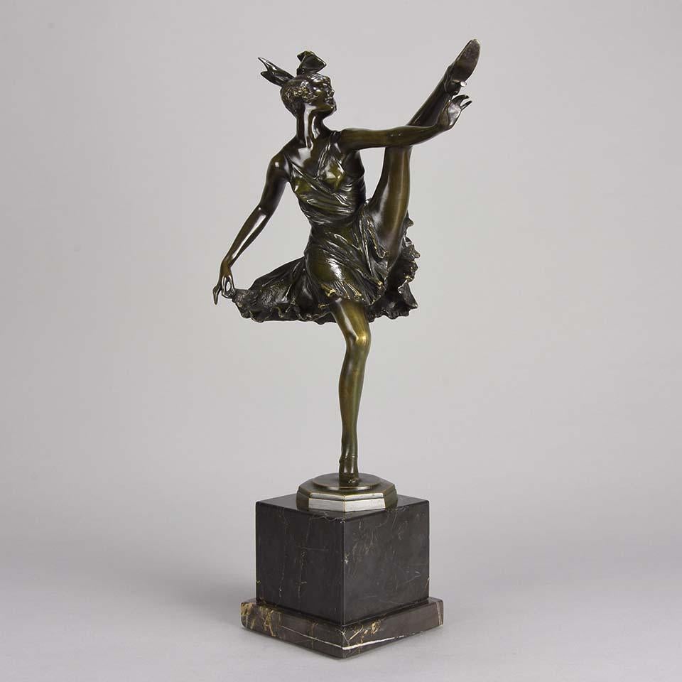 Fabulous Art Deco bronze figure of an energetic dancer with her leg raised high. The surface of the bronze with excellent deep dark color and very fine hand finished detail, raised on a marble base and signed B Zach.