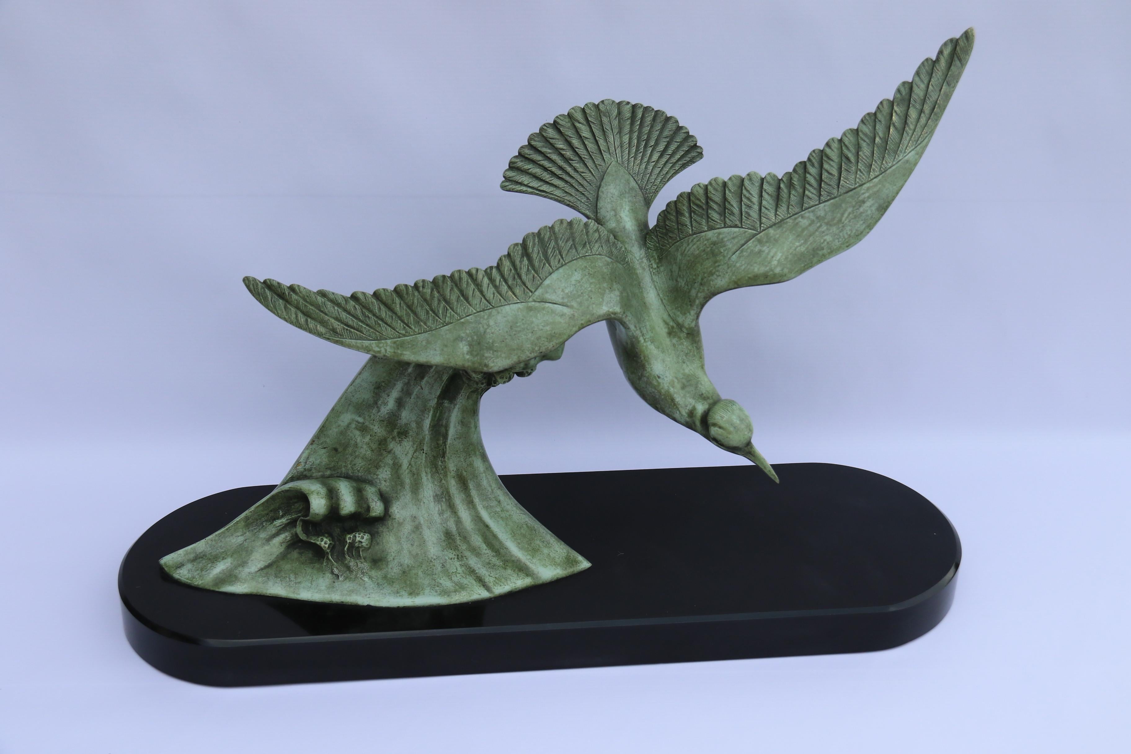 A large and impressive art deco bronze study of an albatross on the wing above a crested wave, by Emile Dautrive circa 1930

This most eye catching and stylish large art deco bronze study depicts a large albatross swooping in strong winds above a