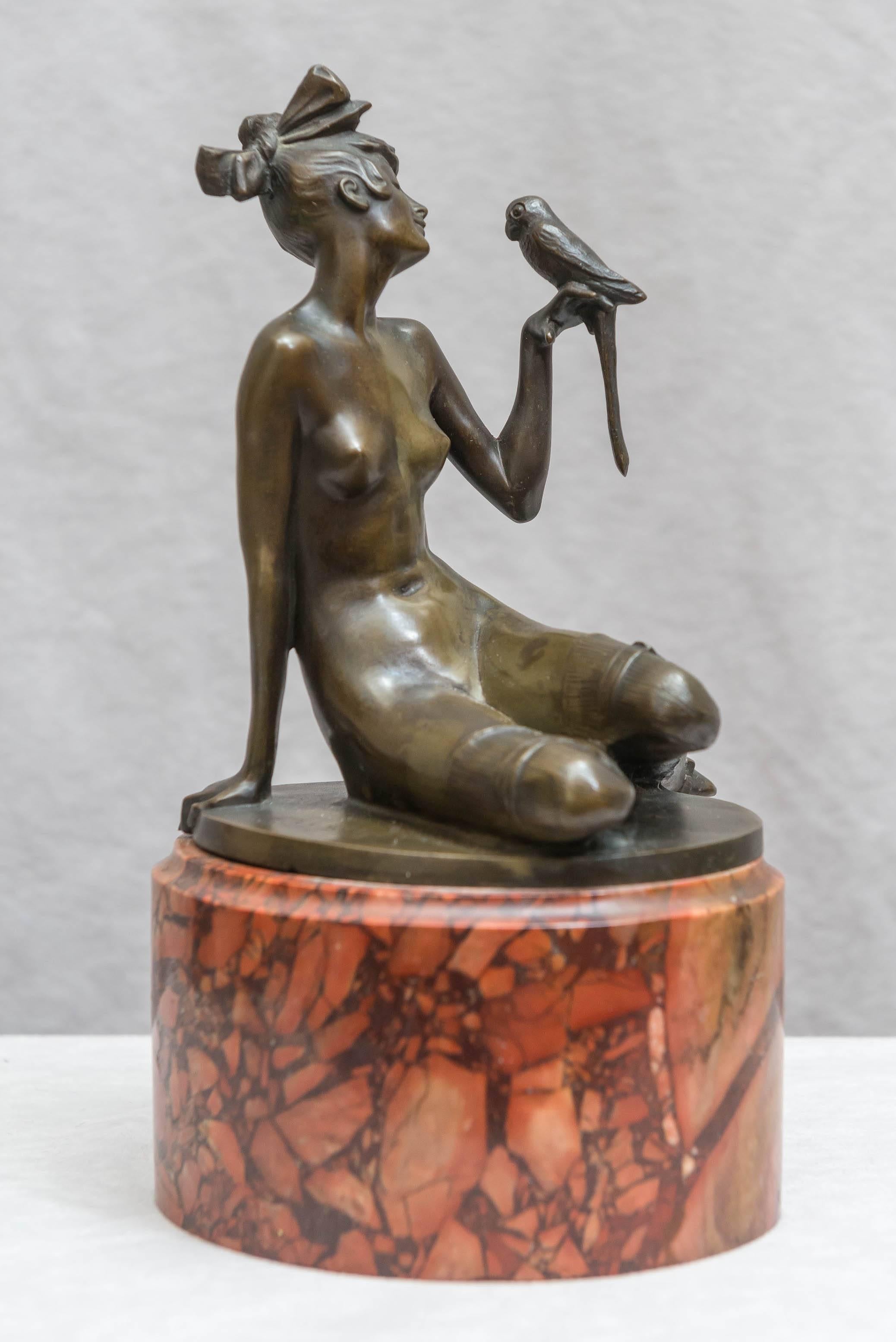 Hand-Crafted Art Deco Bronze Group of a Nude Woman Holding a Parrot, Red Marble Base