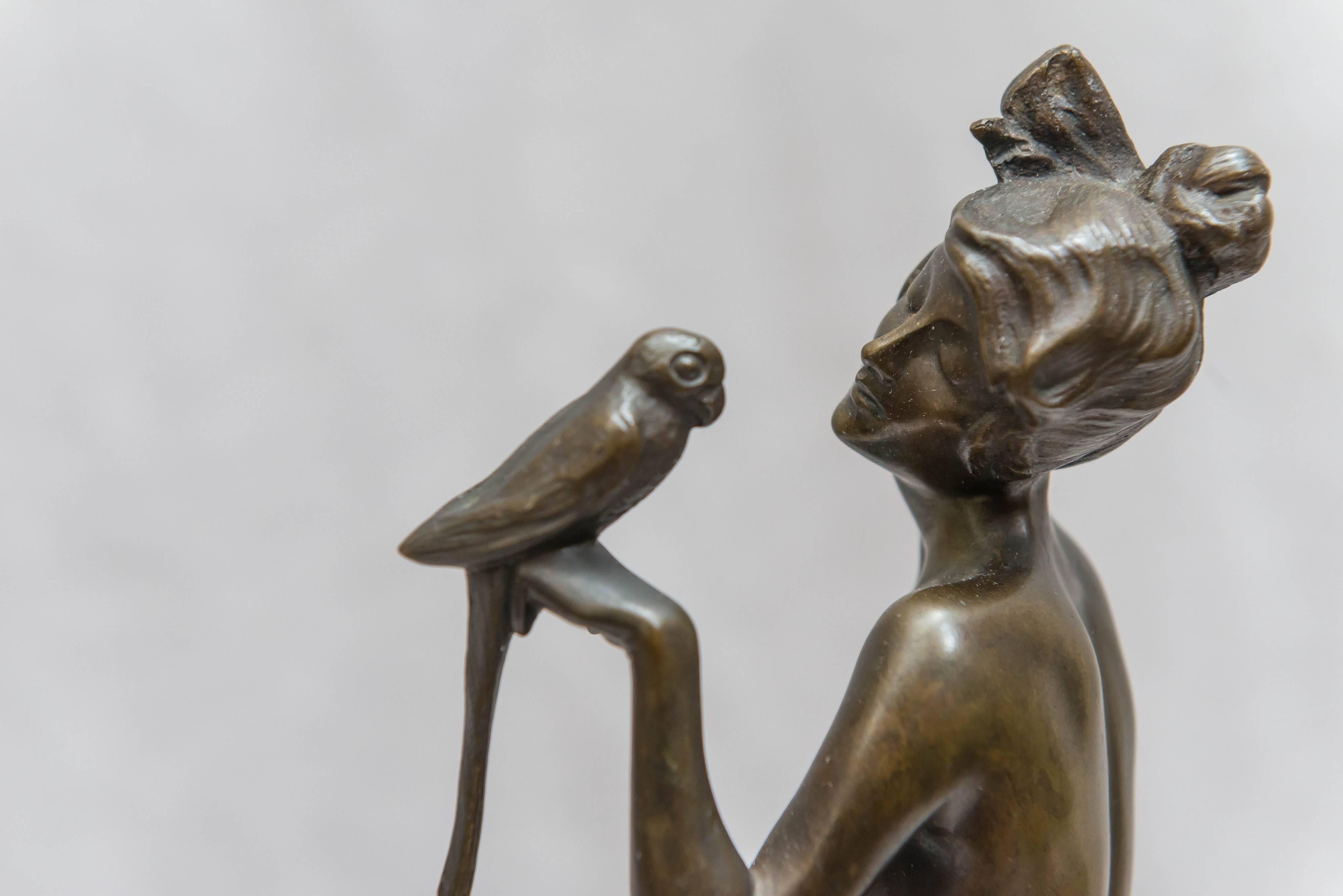 Early 20th Century Art Deco Bronze Group of a Nude Woman Holding a Parrot, Red Marble Base