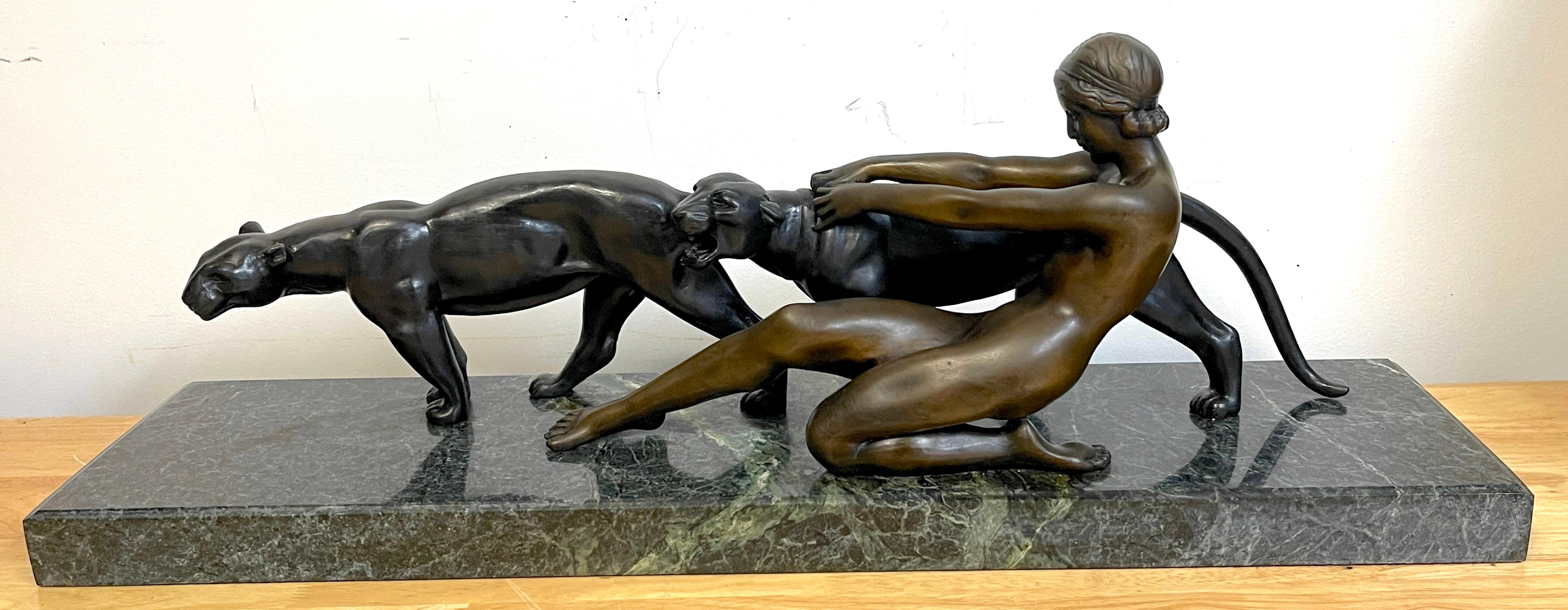 Art Deco bronze lady with two panthers, by Alexandre Ouline 
Alexandre Ouline (Belgian, active circa 1918–1940)
A fine example of period Art Deco Sculpture, a substantial work, beautifully cast and modeled. Unsigned. 
Raised on a thick verdigris