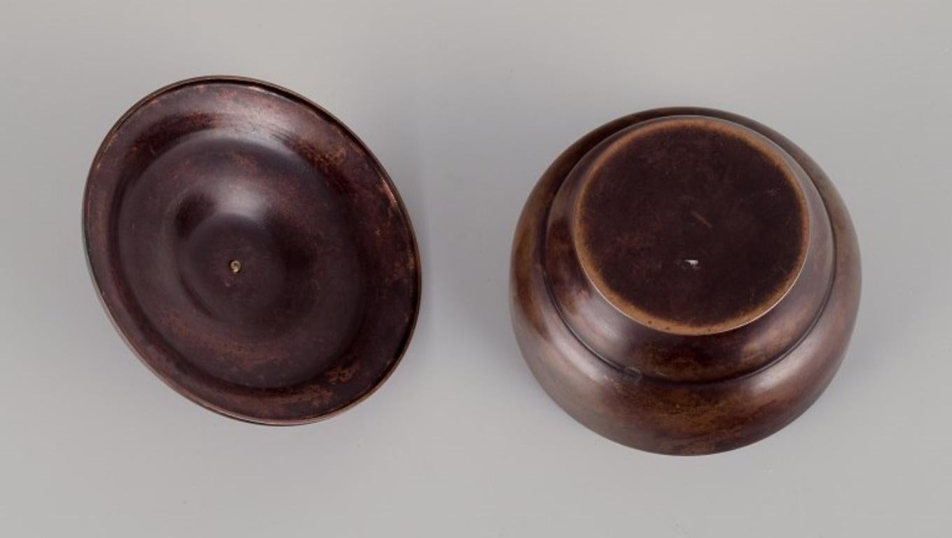 Mid-20th Century Art Deco bronze lidded jar in the style of Just Andersen. For Sale