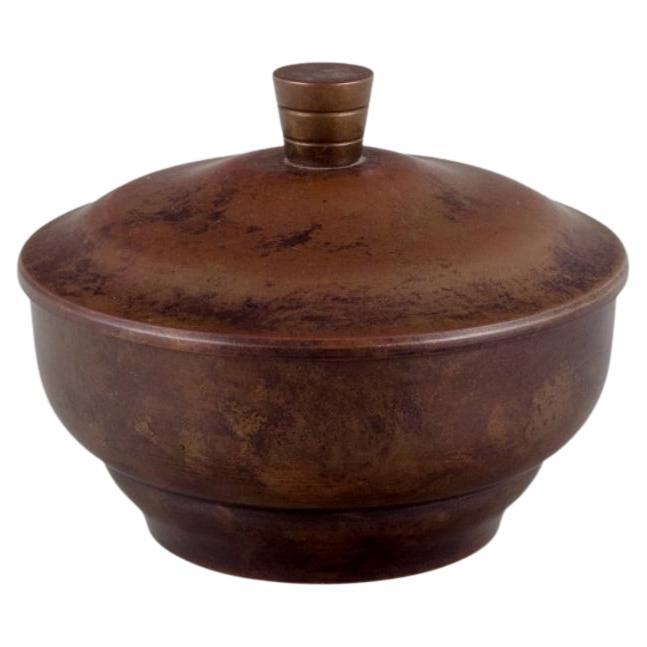 Art Deco bronze lidded jar in the style of Just Andersen. For Sale