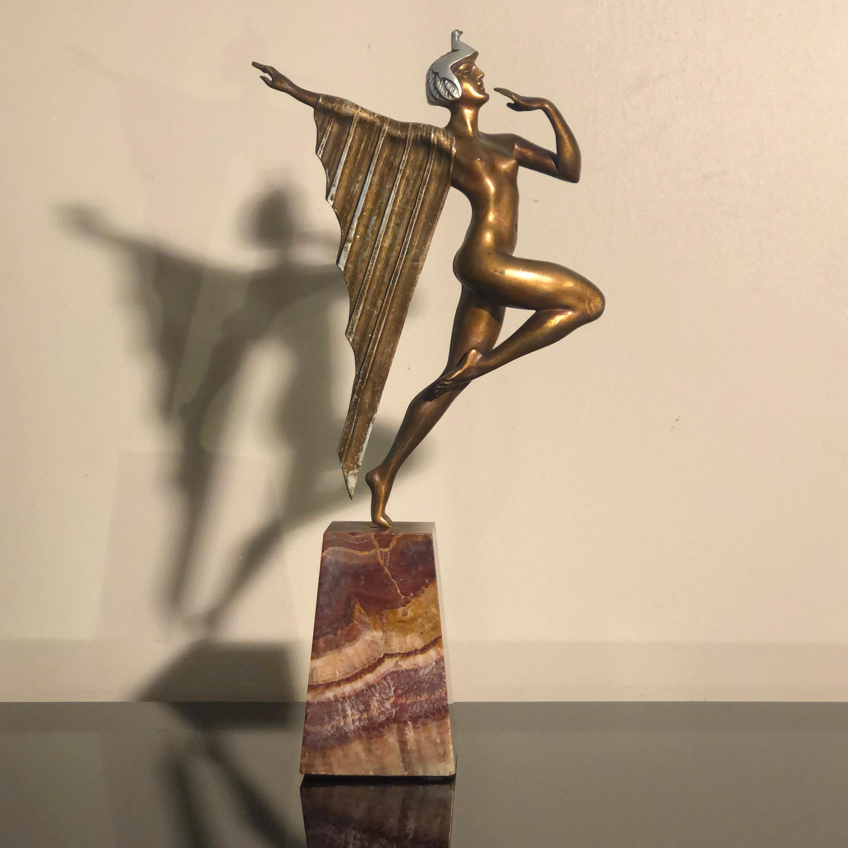 Art Deco bronze marble base Egyptian dancer sculpture, France 1930s

Art Deco sculpture representing an Egyptian Dancer, attributed to French sculptor, Limousin. Casted in cold painted bronze and mounted on red marble stand. The dancer seems to