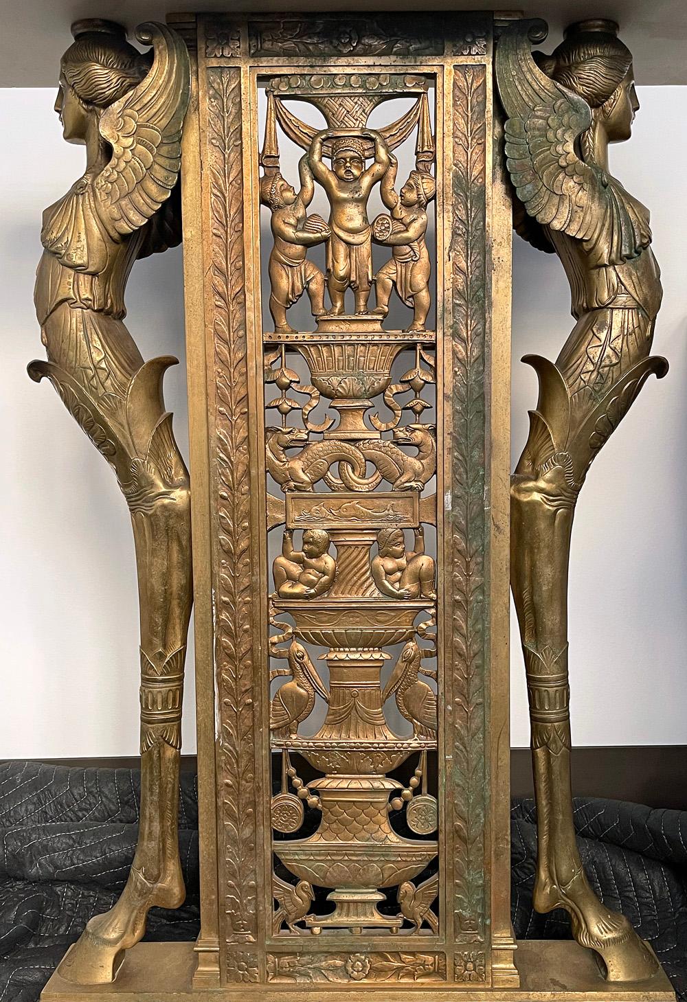 Spectacular and unique, this large and substantial console table features a gorgeous, finely detailed bronze base replete with symbols of Louisiana and the Gulf Coast -- including pelicans, dolphins and sea dragons -- surmounted by a white marble