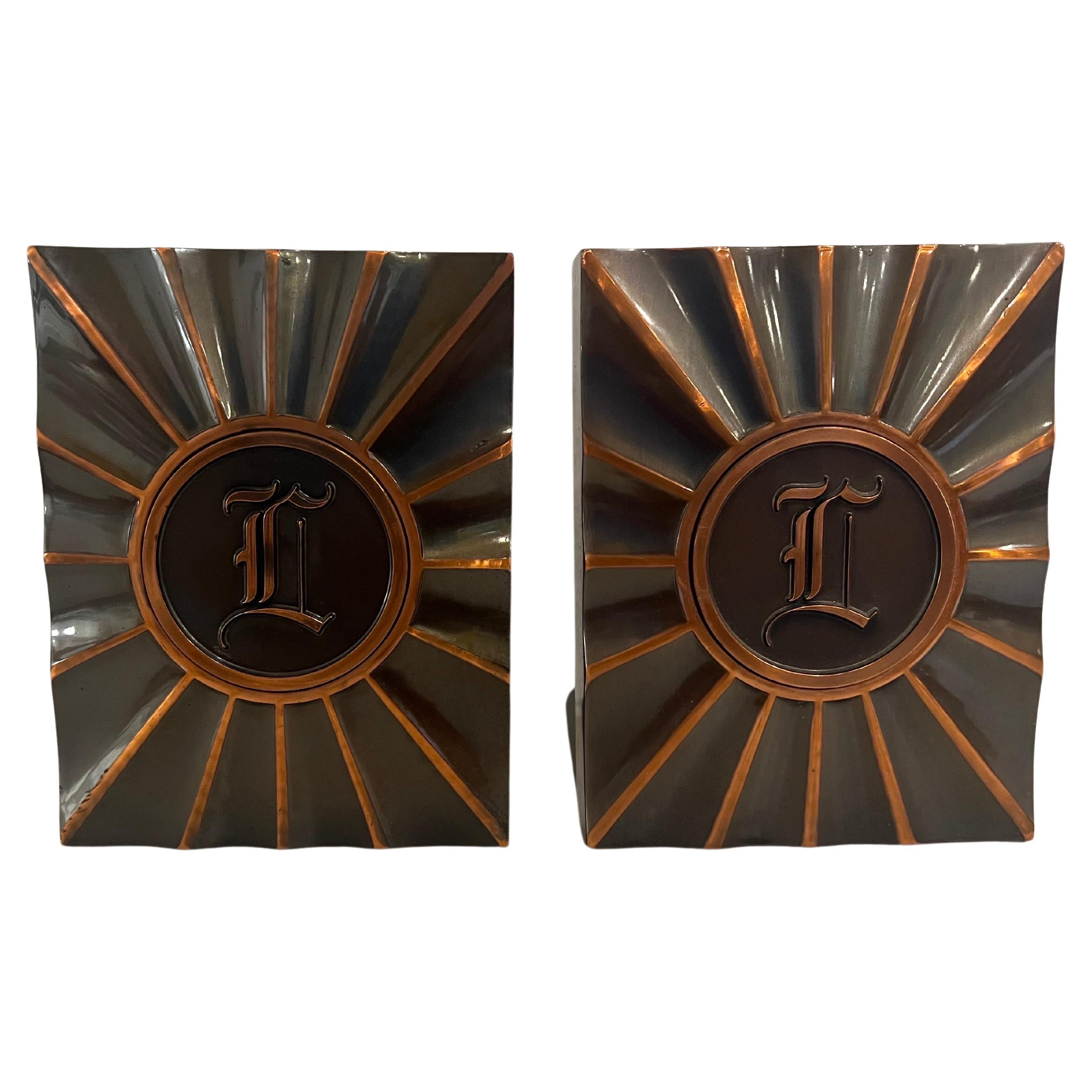 Nice pair of art Deco bookends monogrammed with the letter L, circa 1940's excellent condition very light wear, produced by L.E Mason Company.