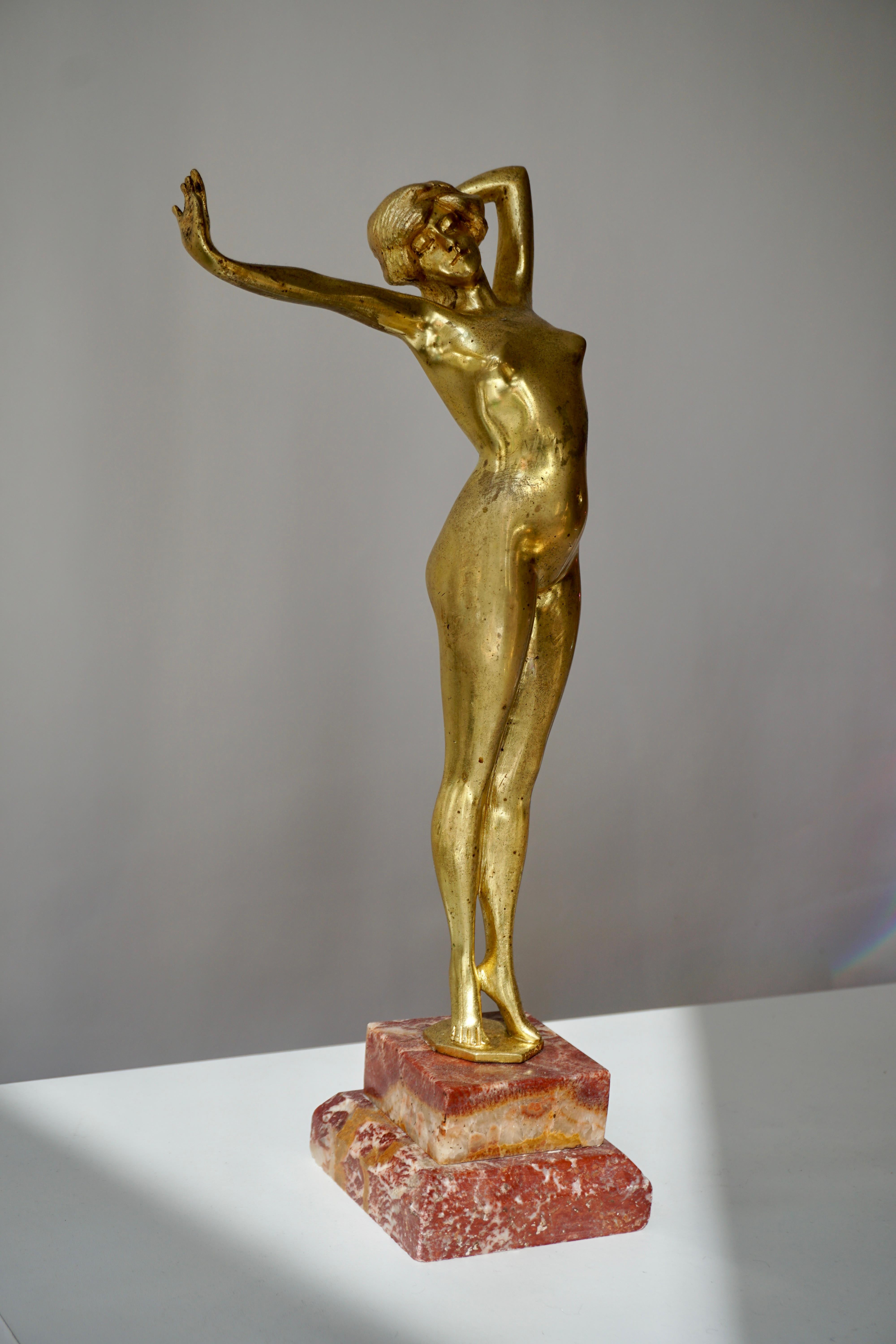 Art Deco gilt bronze statue signed Reveil. This sculpture was made in the mid-1920s in the Art Nouveau and Art Deco period.
It was probably made by Paul Philippe.This is authentic, vintage, in gilded bronze with a natural patina, and a beautiful