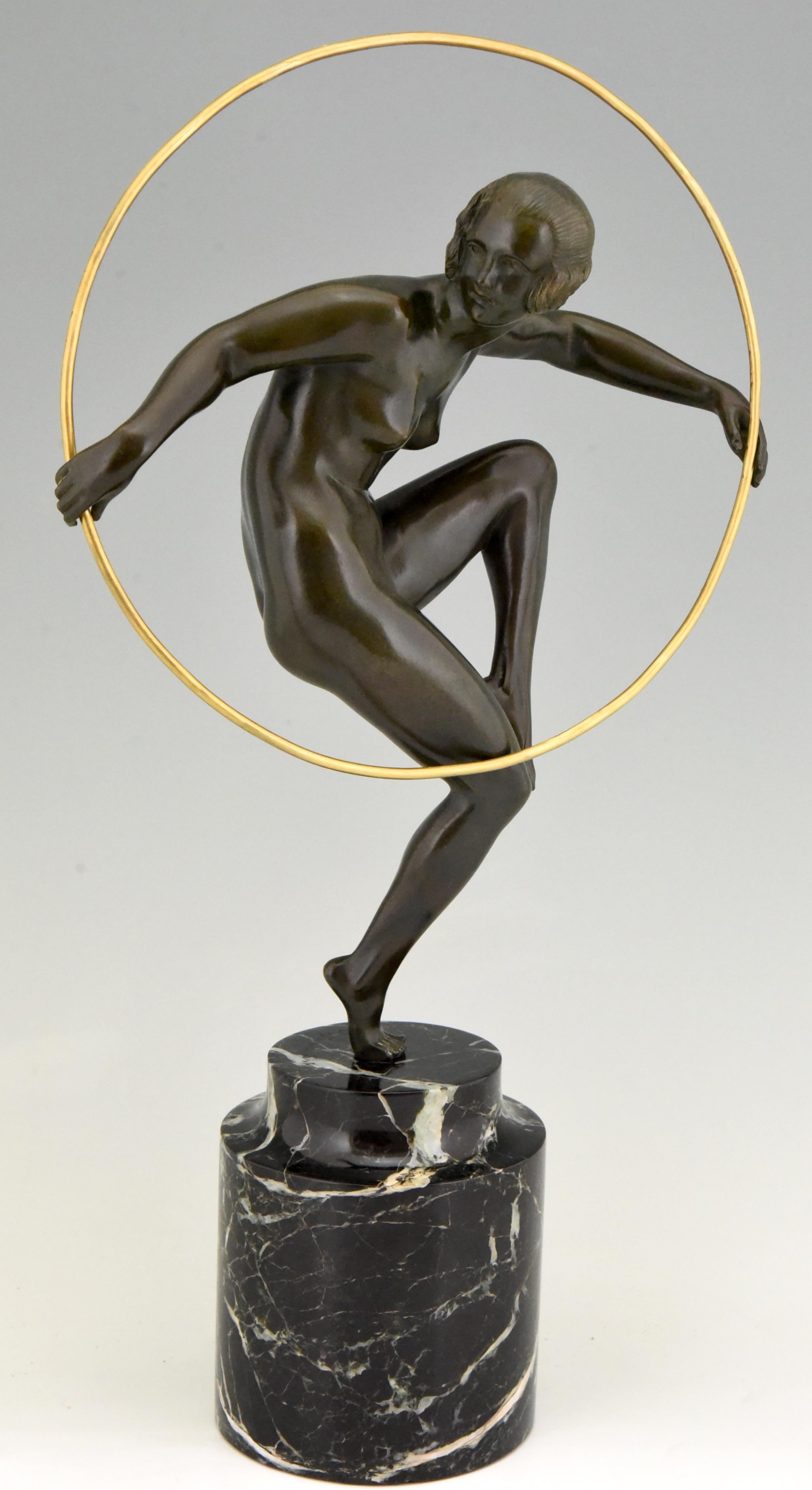 Girl with hoop.
Nude dancing on one leg holding a hoop.
Artist/ Maker:
Marcel André Bouraine, 1886-1948. 
Signature/ Marks:
A. Bouraine.
Style:
Art Deco.
Date:
circa 1930.
Material: 
Patinated bronze on a marble base. 
Origin: