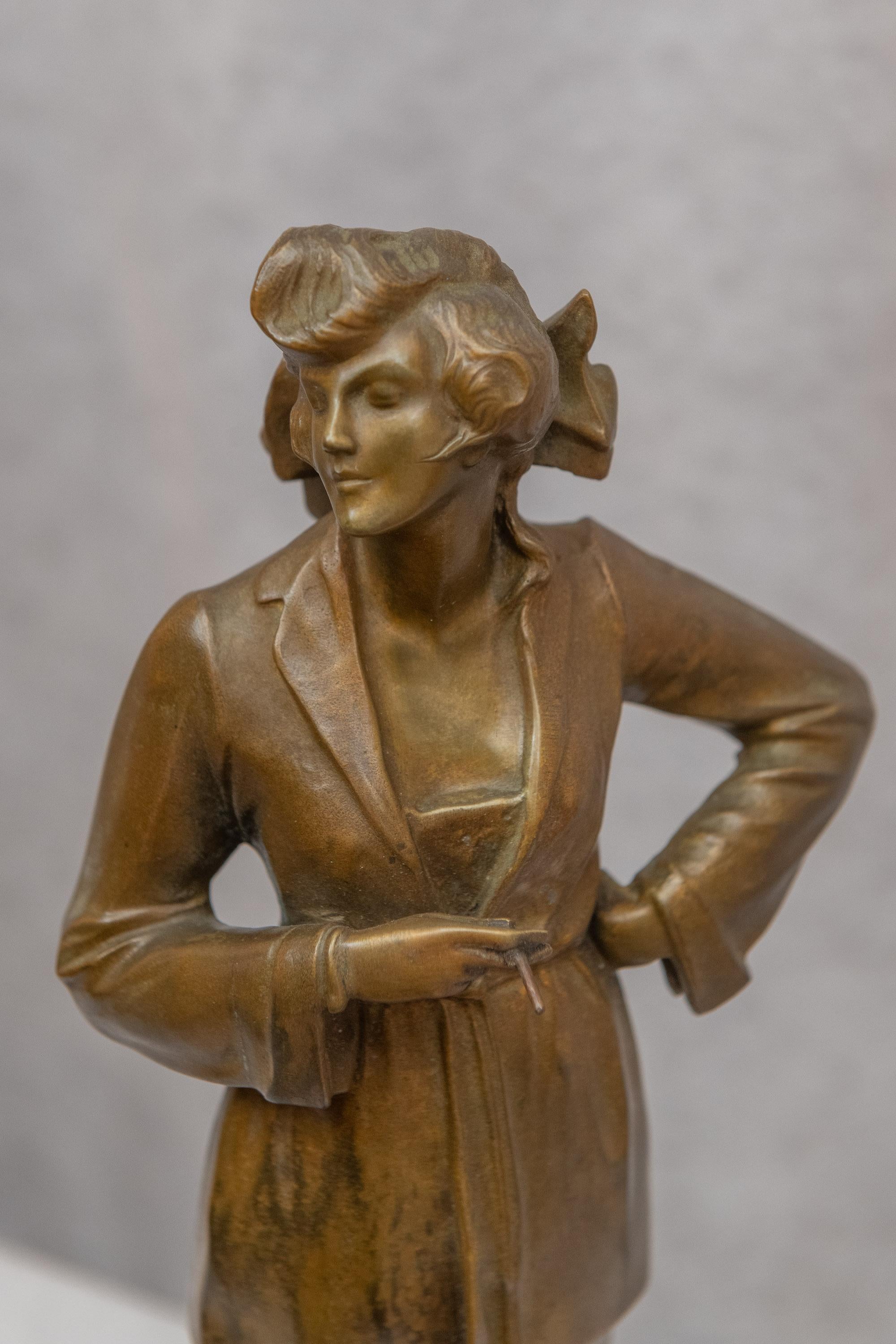Although this bronze is unsigned, there can be no doubt that this was done by the great Art Deco artist Bruno Zach. It's got Zach written all-over it. We love this gal as she stands there in a pant's suit and holding a cigarette. She is of the early