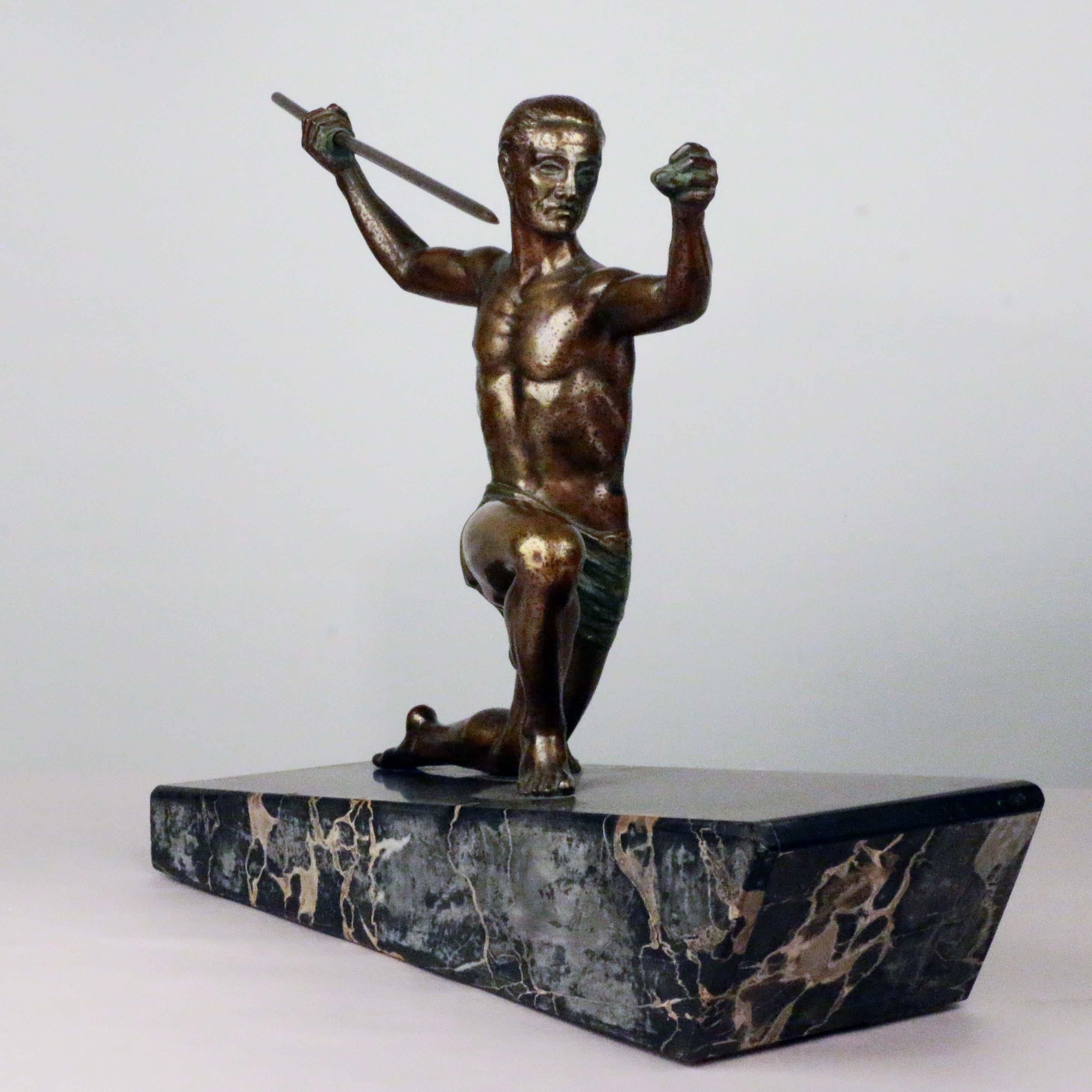 Art Deco patinated and polychrome painted bronze of kneeling javelin thrower on black marble and slate base, signed H. Molins on rear leg.

Enrique Molins-Balleste was born in Barcelona, a Spanish artist who later moved to Paris. It would appear
