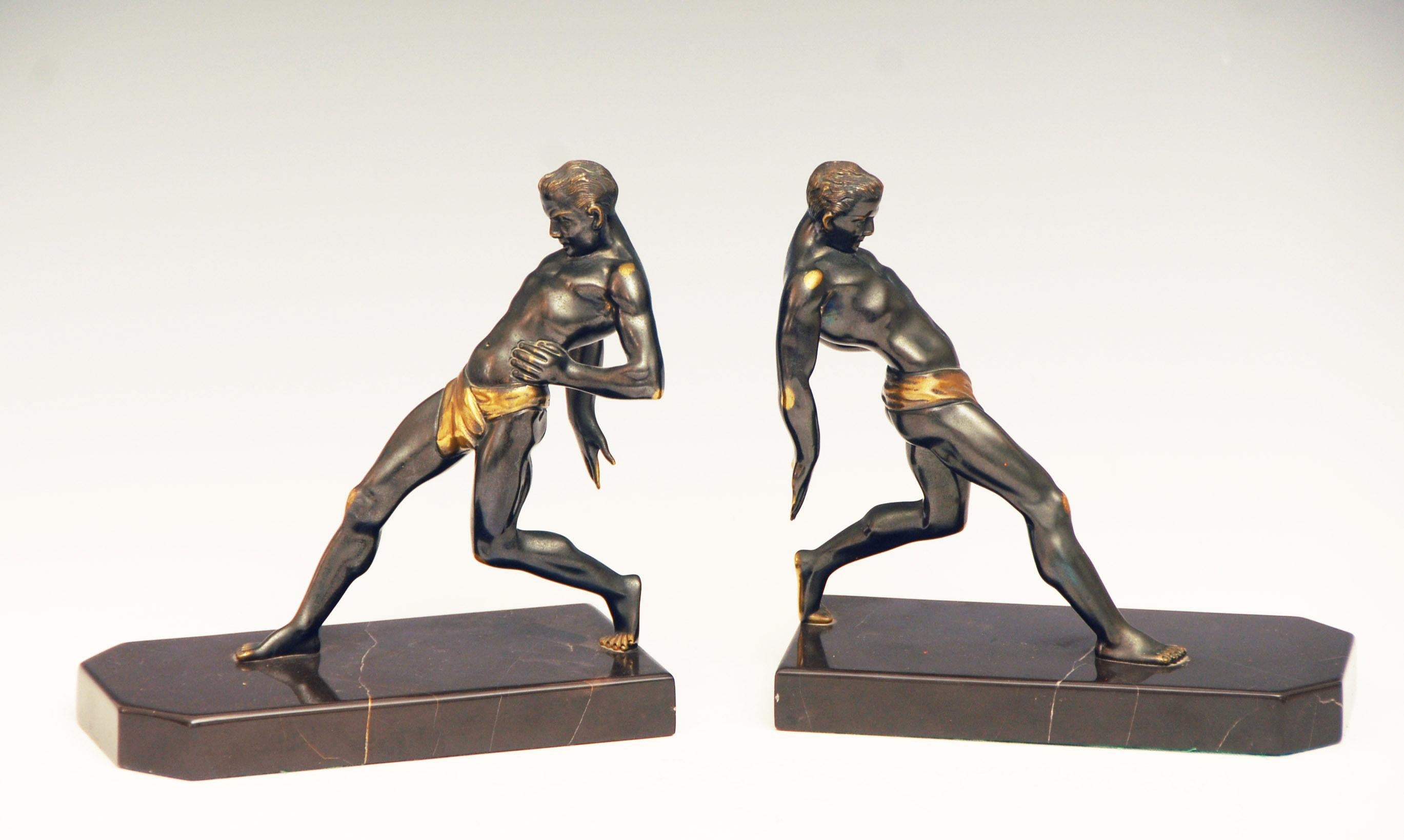 Wonderful large pair of original Art Deco Bookends modeled as Olympian athletes. 

Patinated Bronze with very fine detail in the casting, very heavy substantial pieces.

Very good condition, price includes free shipping to anywhere in the world.