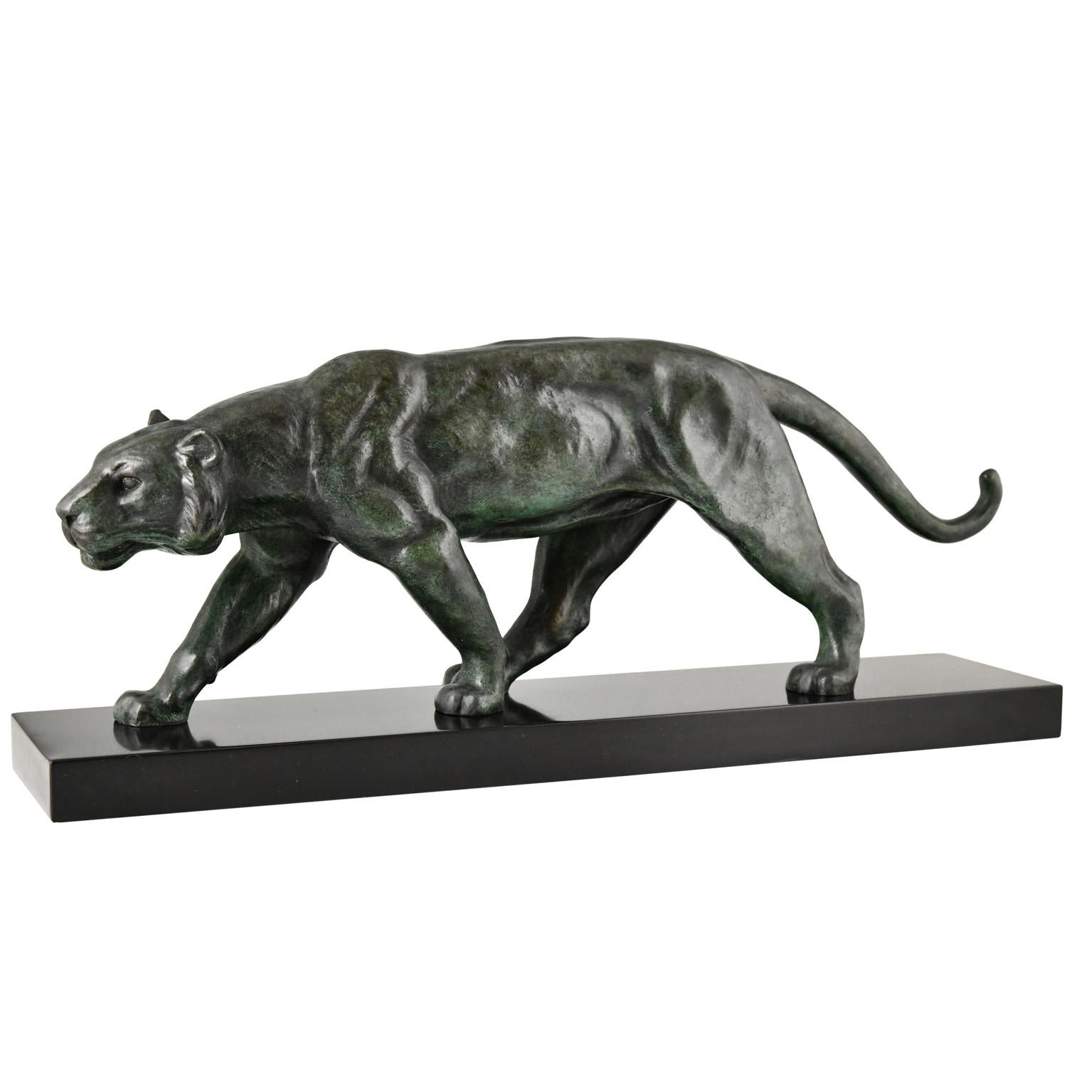 Art Deco bronze panther sculpture by Alexandre Ouline.
Bronze with green patina on Belgian black marble base 
France ca. 1930.
The artist worked in France between 1918-1940.
 
Literature:
Animals in bronze by Christopher Payne. Antique