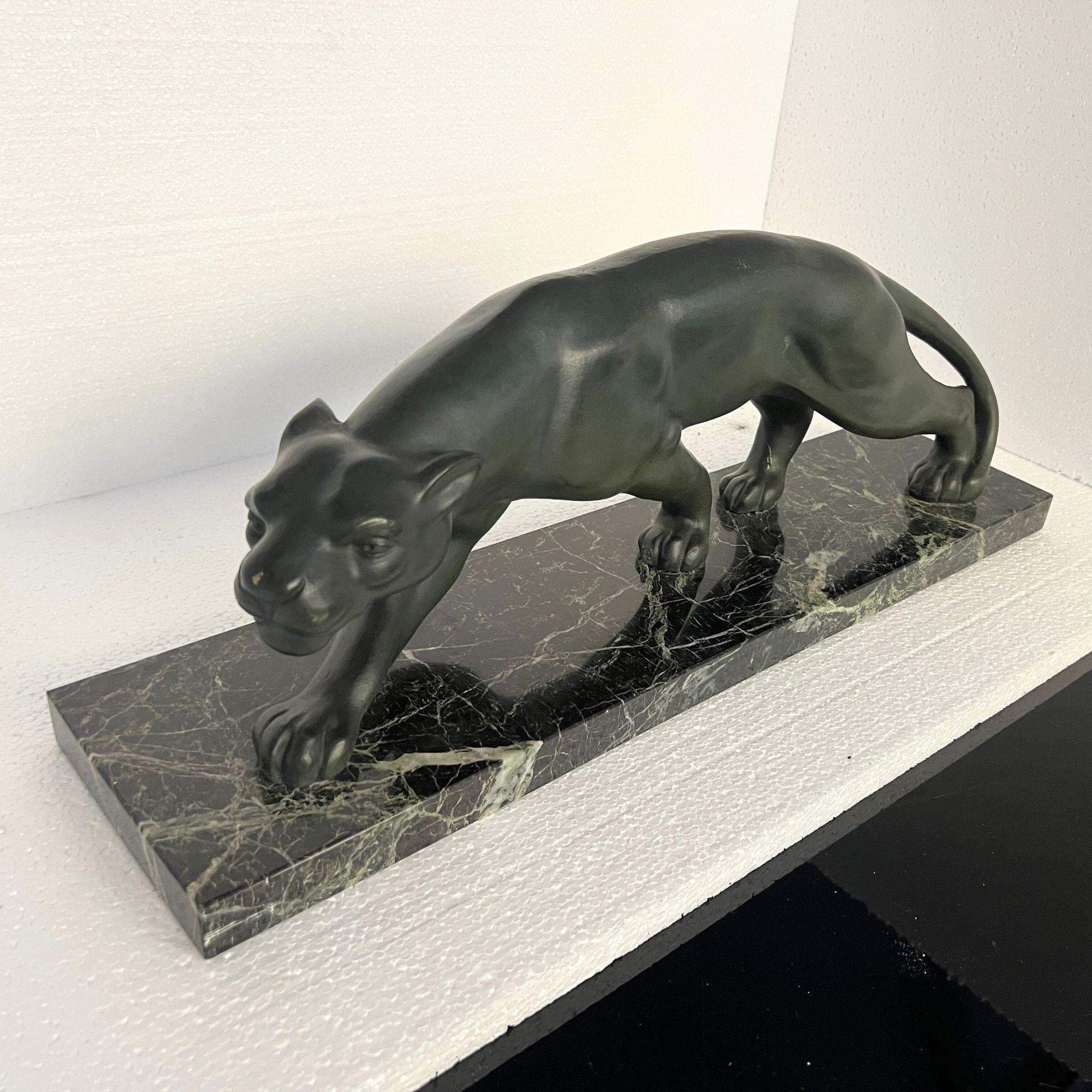 Elegant Art Deco Panther sculpture by Secondo from France circa 1930.

Beautiful green patinated bronze with carvings that create the illusion of fur. Standing on a rectangular greenish marble plinth.
Signature ‚SECONDO’ (Italian artist living in