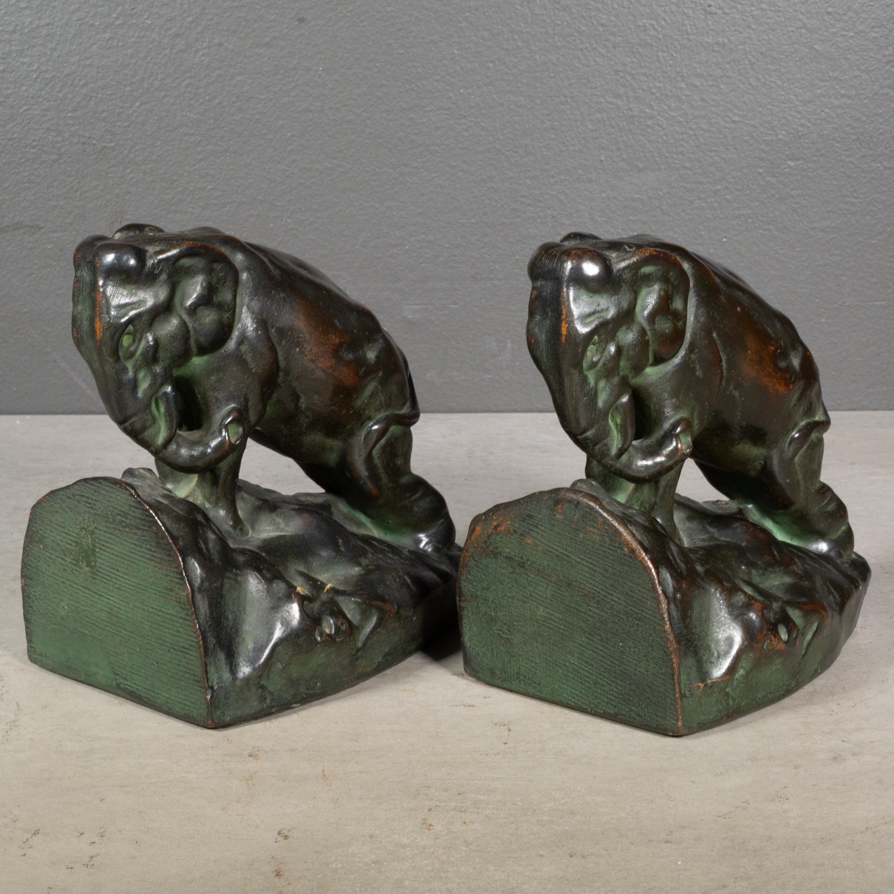 ABOUT

An original pair of Art Deco bronze elephant bookends with original label and felt on each bookend. 

    CREATOR Unknown. 
    DATE OF MANUFACTURE c.1920-1930
    MATERIALS AND TECHNIQUES Galvanized Bronze, Felt. 
    CONDITION Good. Wear