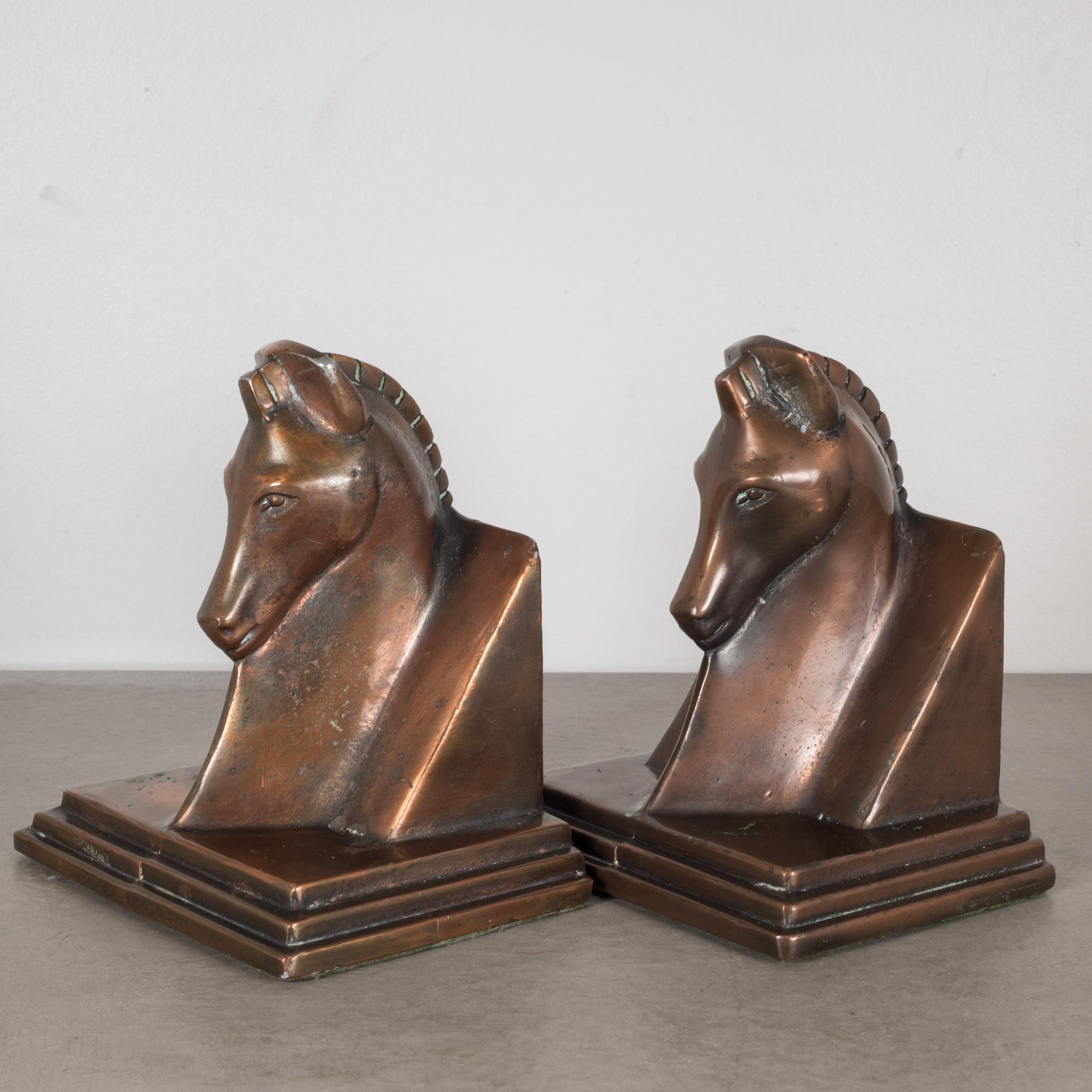 About

This is a pair of Art Deco bronze plated horse bookends with the original felt on the bottom. Both bookends are in good condition and have retained their bronze finish and have the appropriate patina consistent with age and use.

Creator