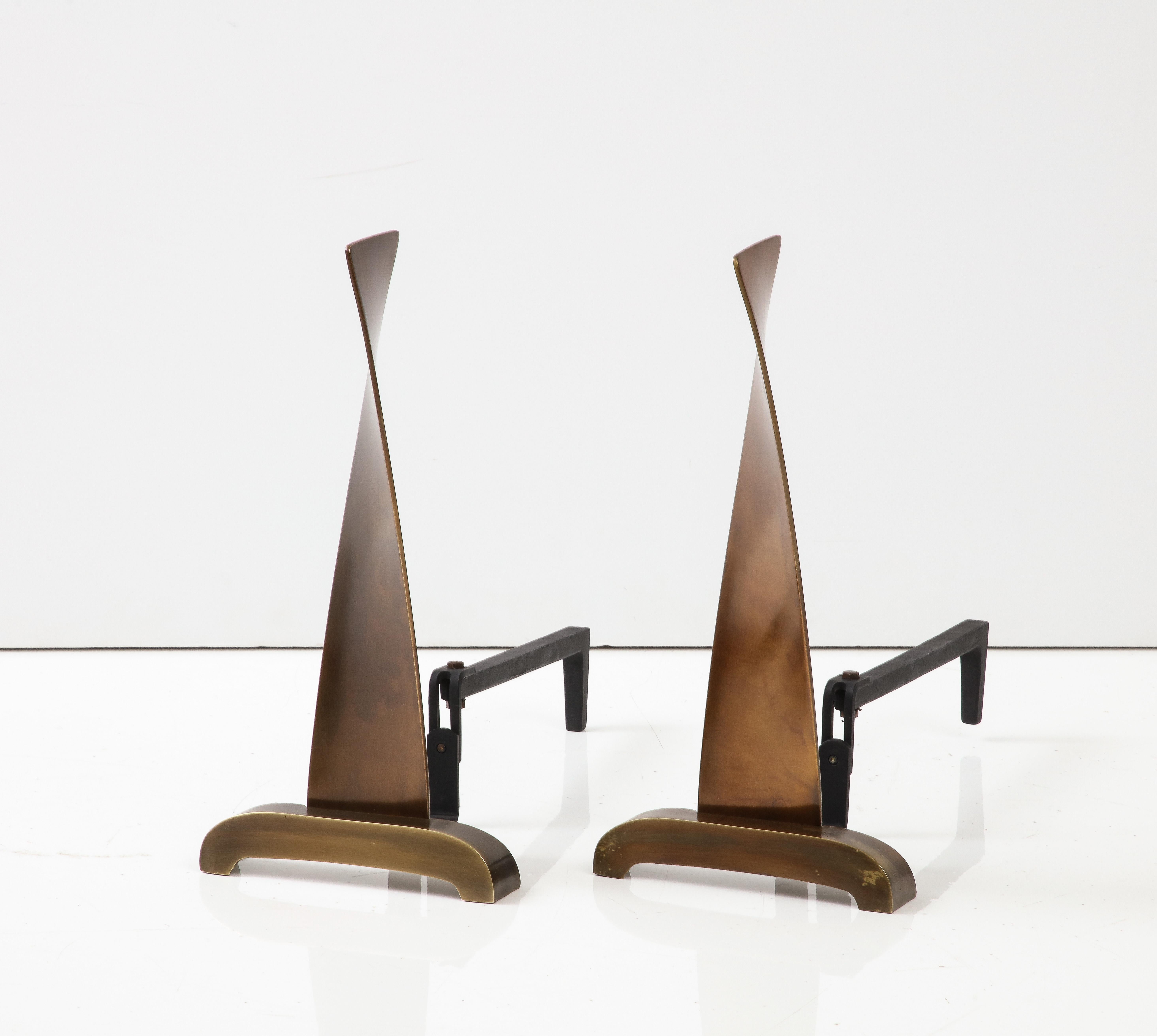 Art Deco bronze stylized propeller andirons with black cast iron backs.