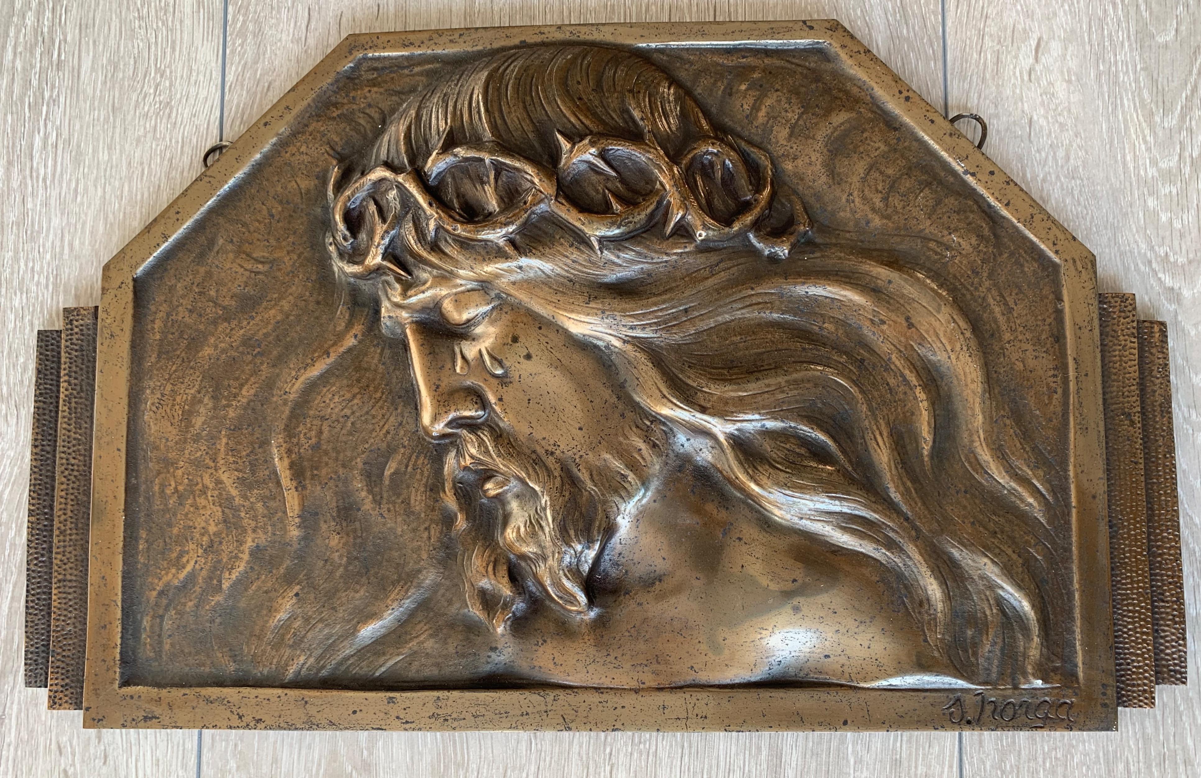 Impressive bronze plaque with a marvelous patina, by S. Norga. 

Most (young) people won't realize, but in order to spiritually and mentally grow in life, some hardship is actually needed. When you are suffering this is obviously not something