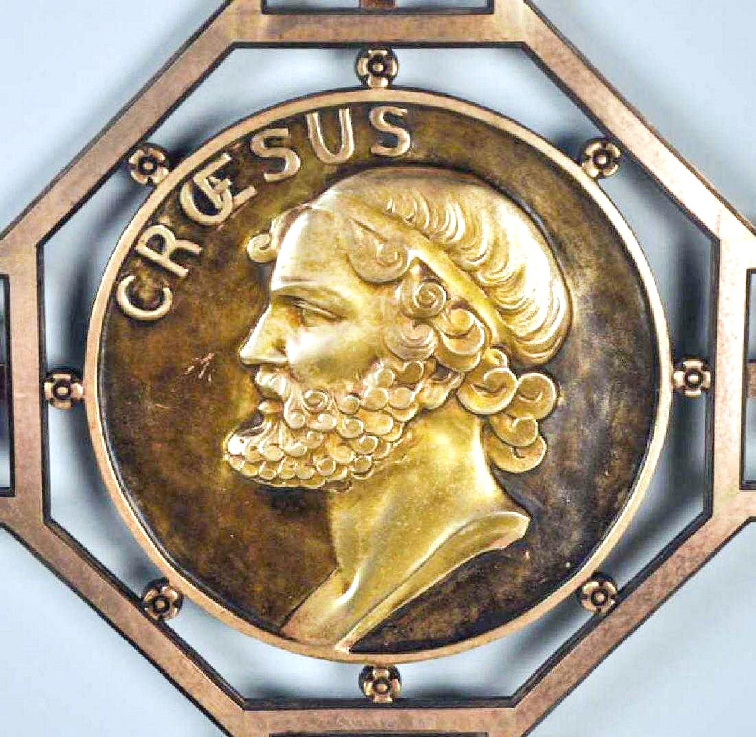 This luxury decorative and heavy bronze partition screen is designed in an artistic, creative Art Deco style. A gilded bronze medallion with the image of King Croesus is placed in the cross point of the screen. The casting is of highest quality.