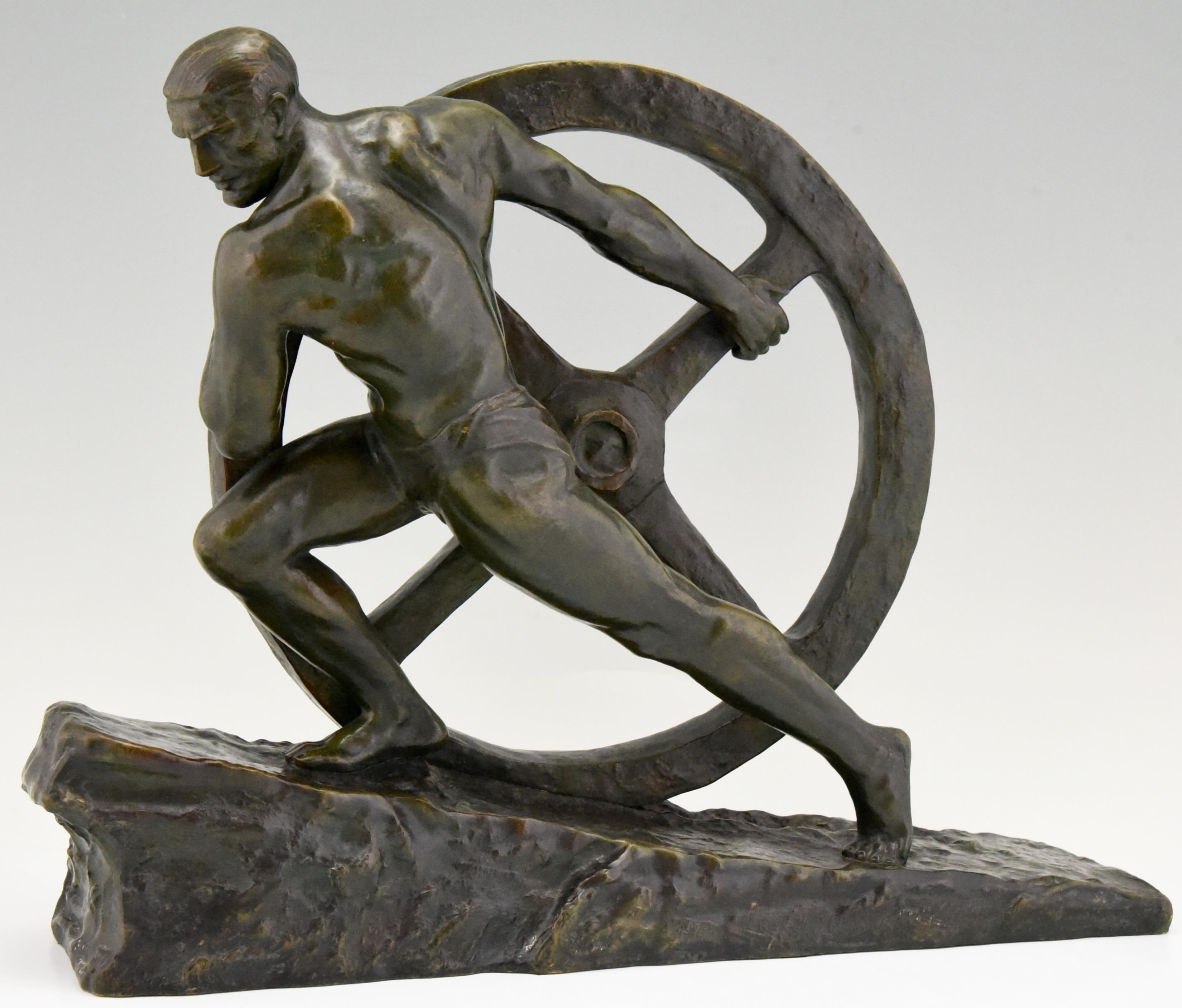 Art Deco bronze sculpture of a male nude athlete pushing a wheel 