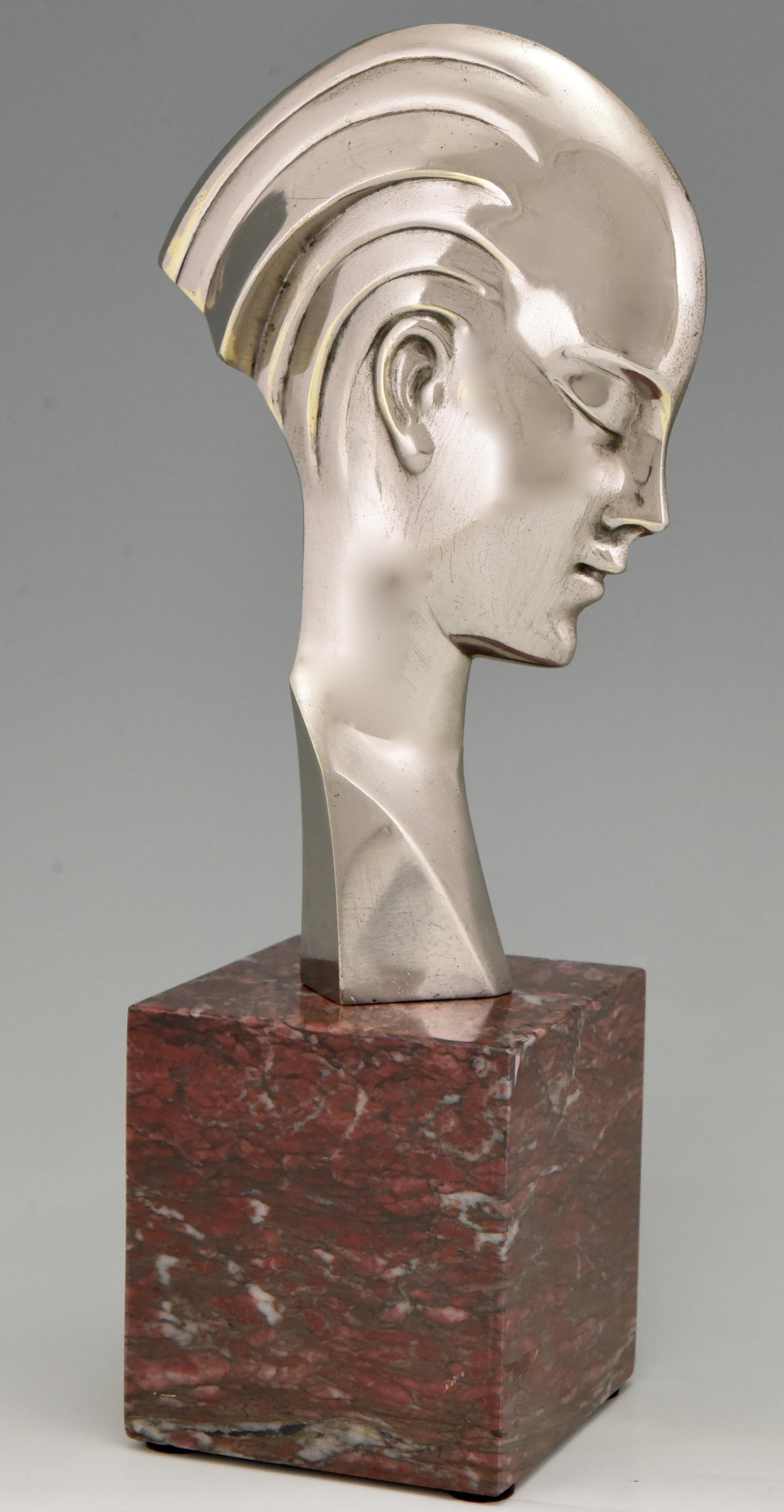 Stylish Art Deco bronze bust of a woman in profile. 
Attributed to Guido Cacciapuoti.
The bronze has a silver patina and stands on a red marble base. 
Italy 1930-1940.