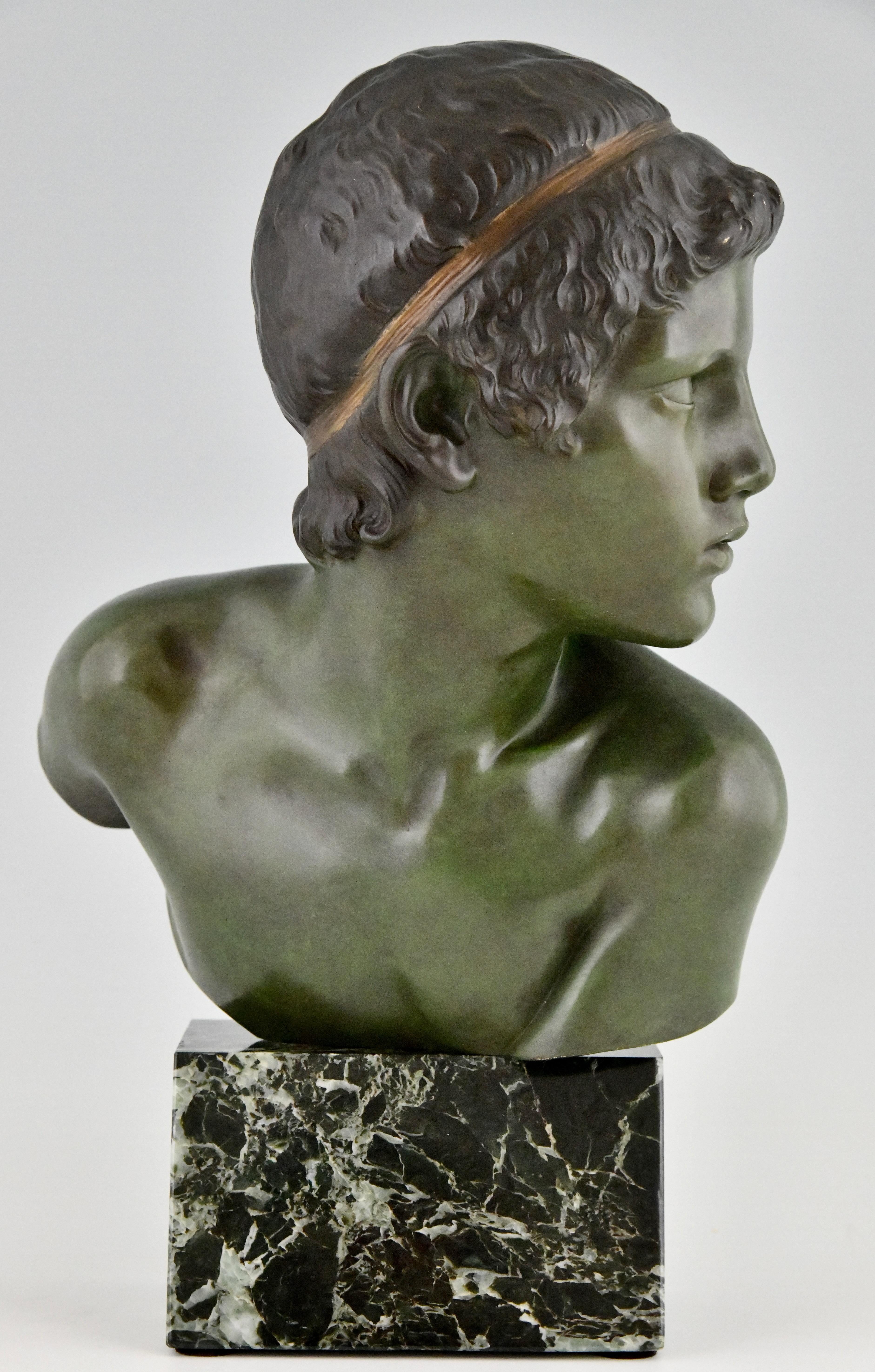 Art Deco bronze sculpture of Achilles as a child. The bronze bust is signed by Constant Roux (1865-1929) with foundry  mark AG Paris and stamped number. 
The sculpture stands on a green marble base and can be turned, France, 1920. 

This model is