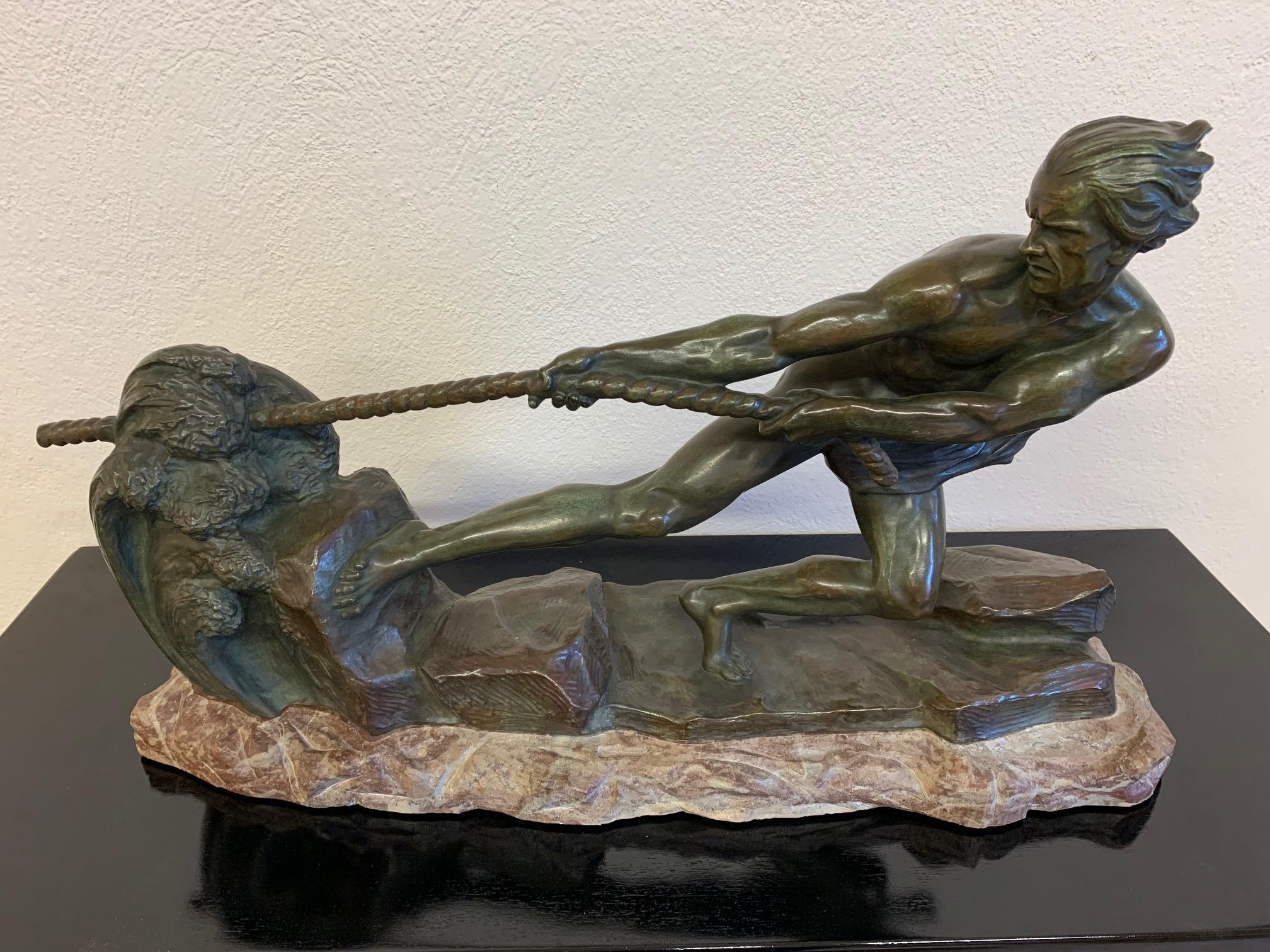This stunning and imposing Art Deco bronze was produced in France in the 1930s. 
It is completely made of bronze and has a particular green patina added with a specific technique that makes it even more exclusive looking. It depicts an athlete
