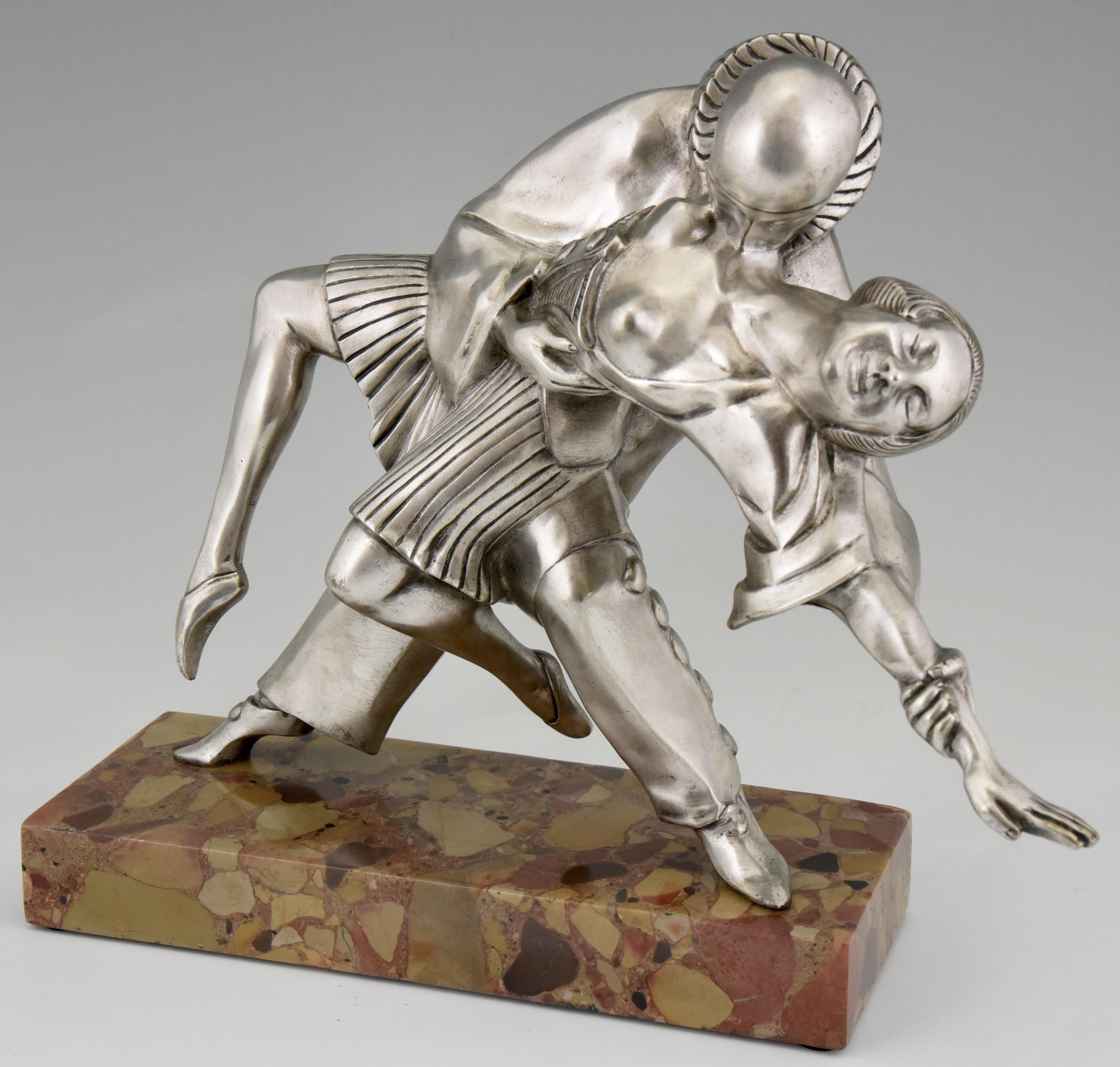 Tango, Art Deco bronze sculpture cubist dancers Pierrot and Colombine by Thomas Cartier, France 1930. 
The bronze has a silver patina and stands on a marble base. 
Literature:
“Bronzes, sculptors and founders” by H. Berman, Abage. ?“Les bronzes