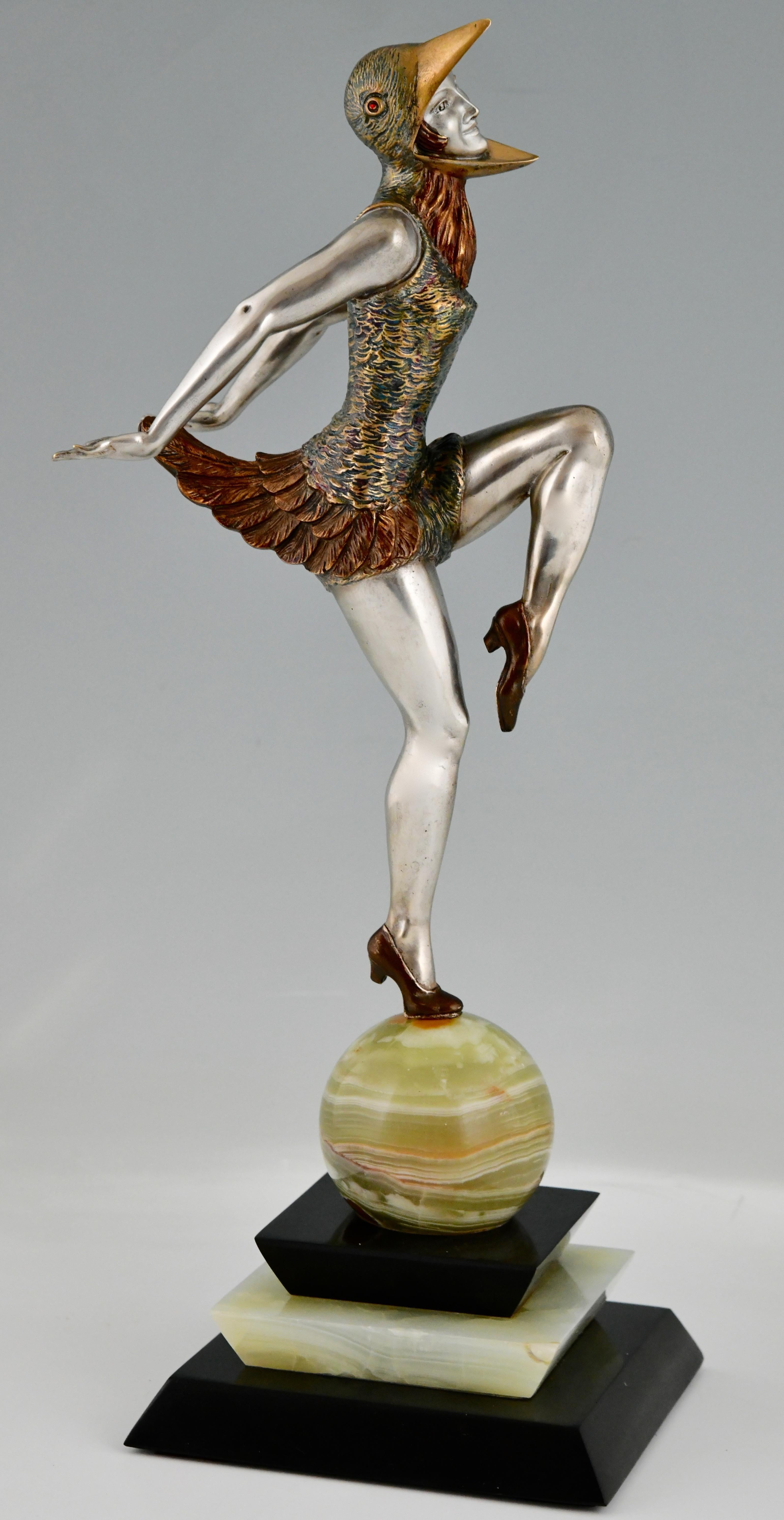 Art Deco bronze sculpture of a dancer in bird costume by Enrique Molins Balleste. 
With Patrouilleau founders’ signature. 
Bronze with multi color patina on a marble and onyx base.
France 1925. 

Literature:
Art Deco and other figures, Brian