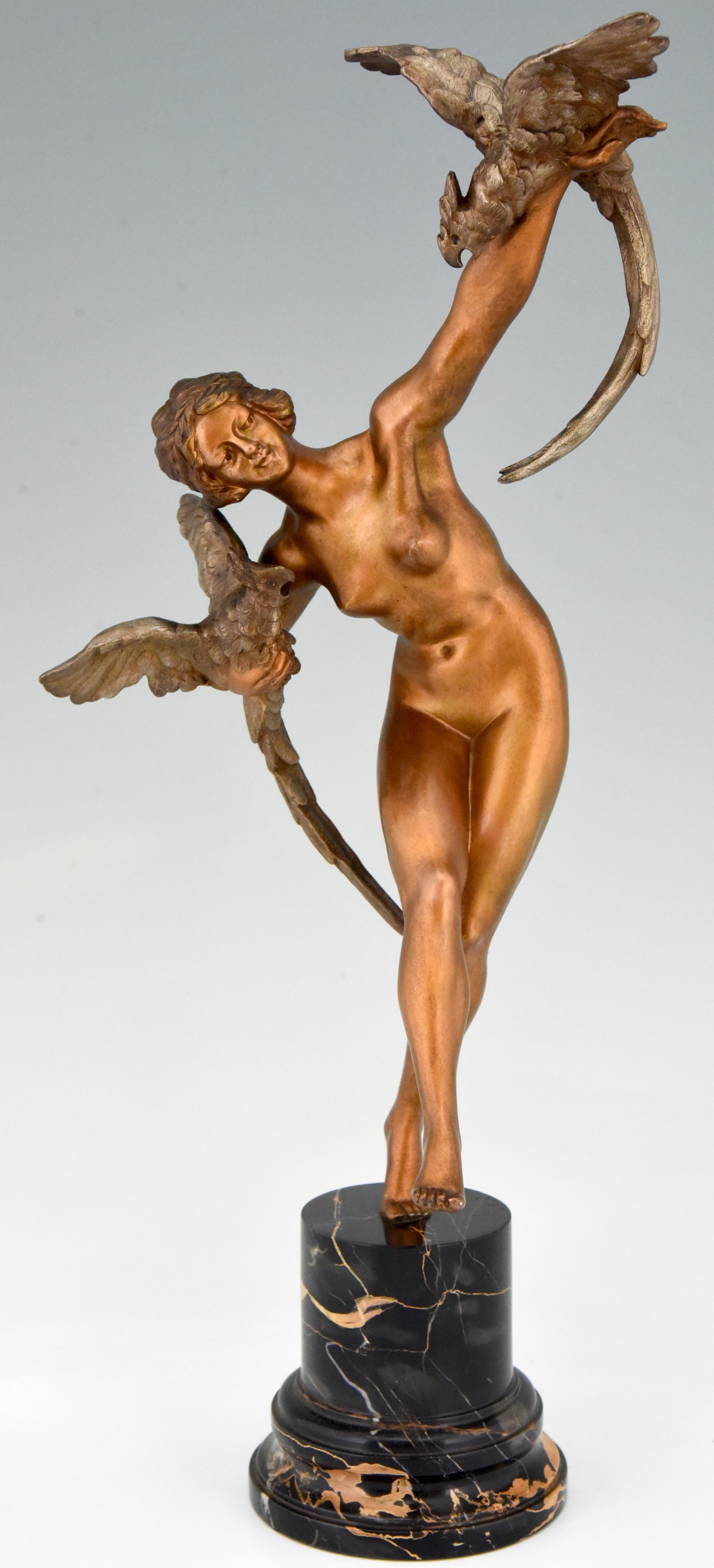 Tall Art Deco bronze sculpture nude dancer with parrots by Claire Jeanne Roberte Colinet.
The bronze has a golden patina and stands on a portor marble base, France, circa 1925.
With les neveux de Lehmann foundry seal. 
 
This model is
