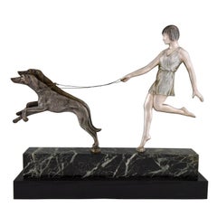 Sculpture en bronze Art Déco Fille avec chiens par Janle:: 1930